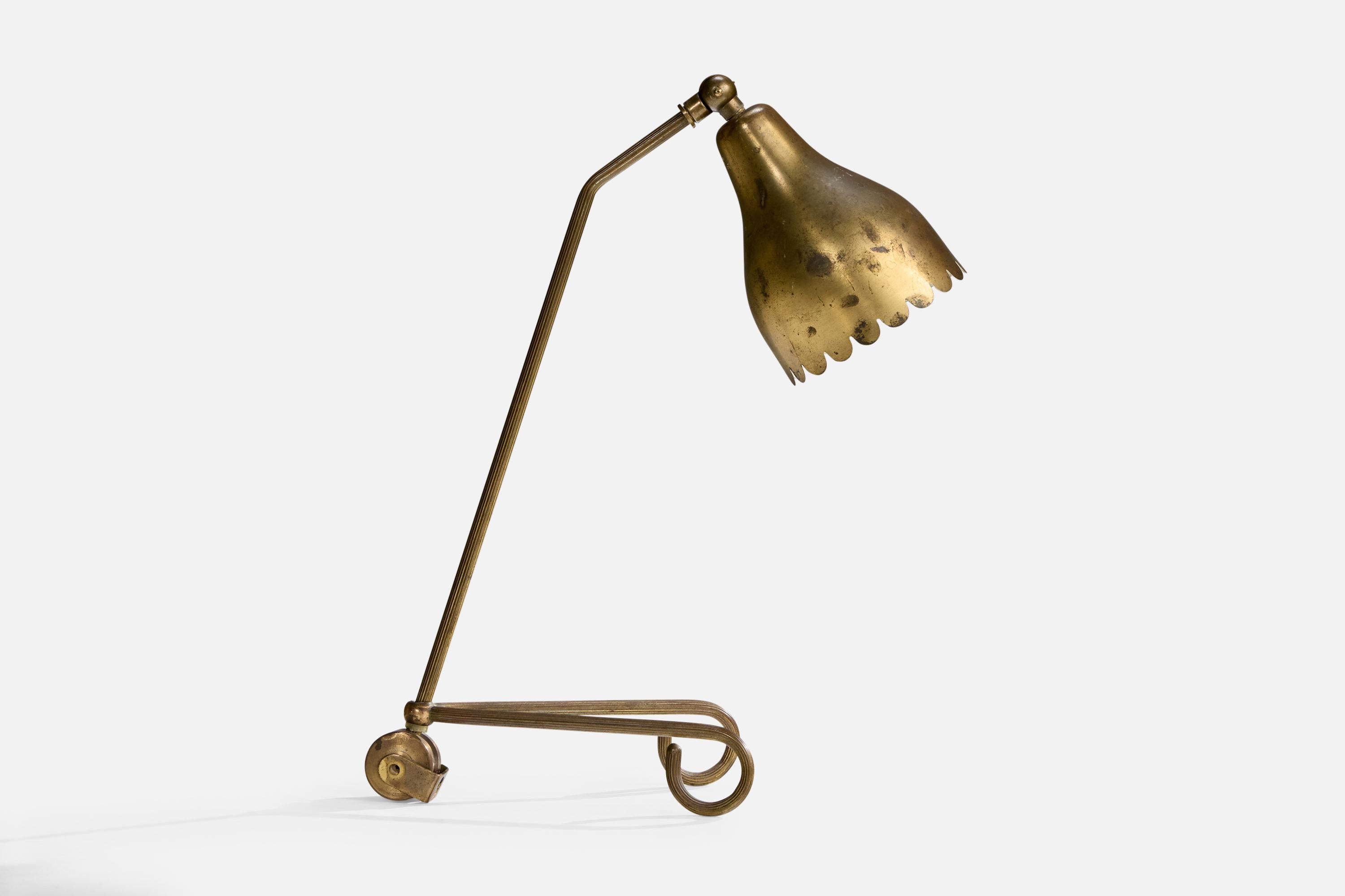 An adjustable brass table lamp attributed t0 Svend Aage Holm Sørensen, Denmark, 1950s.

Dimensions of Lamp (inches): 14.4
