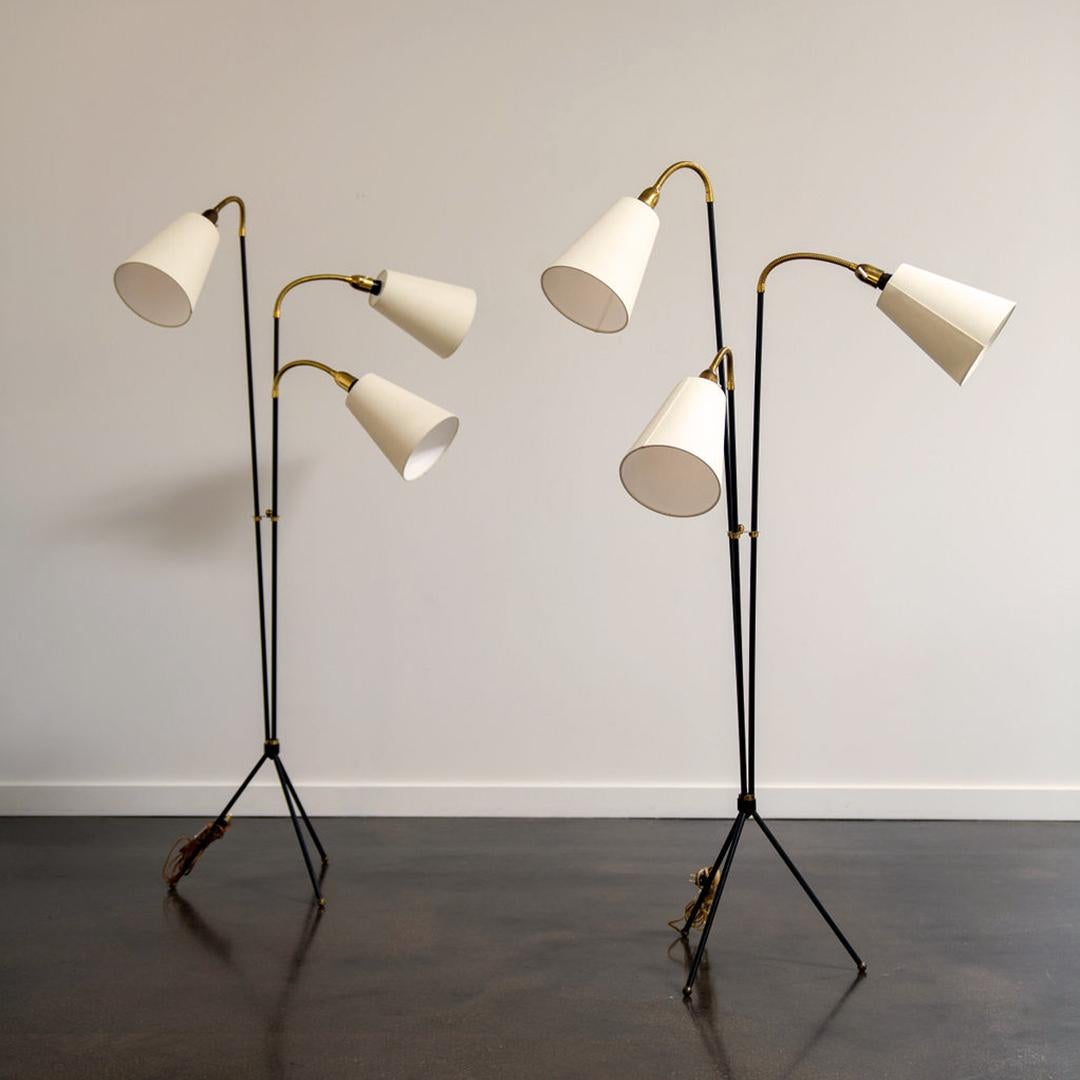 A pair of Svend Aage Holm-Sørensen floor lamps produced by Swedish firm AJH. Impressed manufacturer’s mark to each socket ‘AJH Pat. Each fixture features 3 shades with adjustable arms on a beautifully designed base. The vintage lamp has a slim,