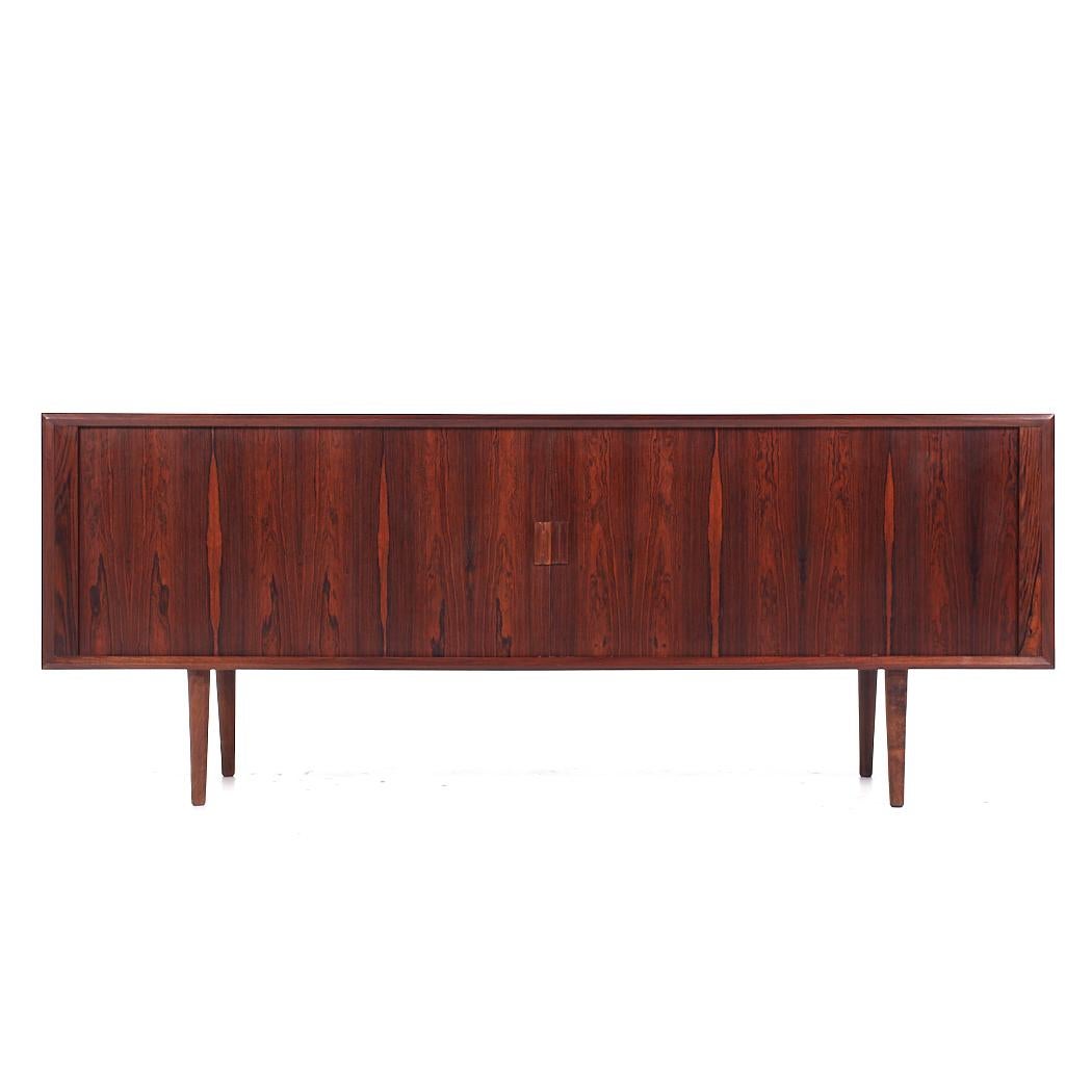 Svend Aage Larsen for Faarup Møbelfabrik Mid Century Danish Rosewood Tambour Door Credenza

This credenza measures: 79.75 wide x 19 deep x 31.25 inches high

All pieces of furniture can be had in what we call restored vintage condition. That means