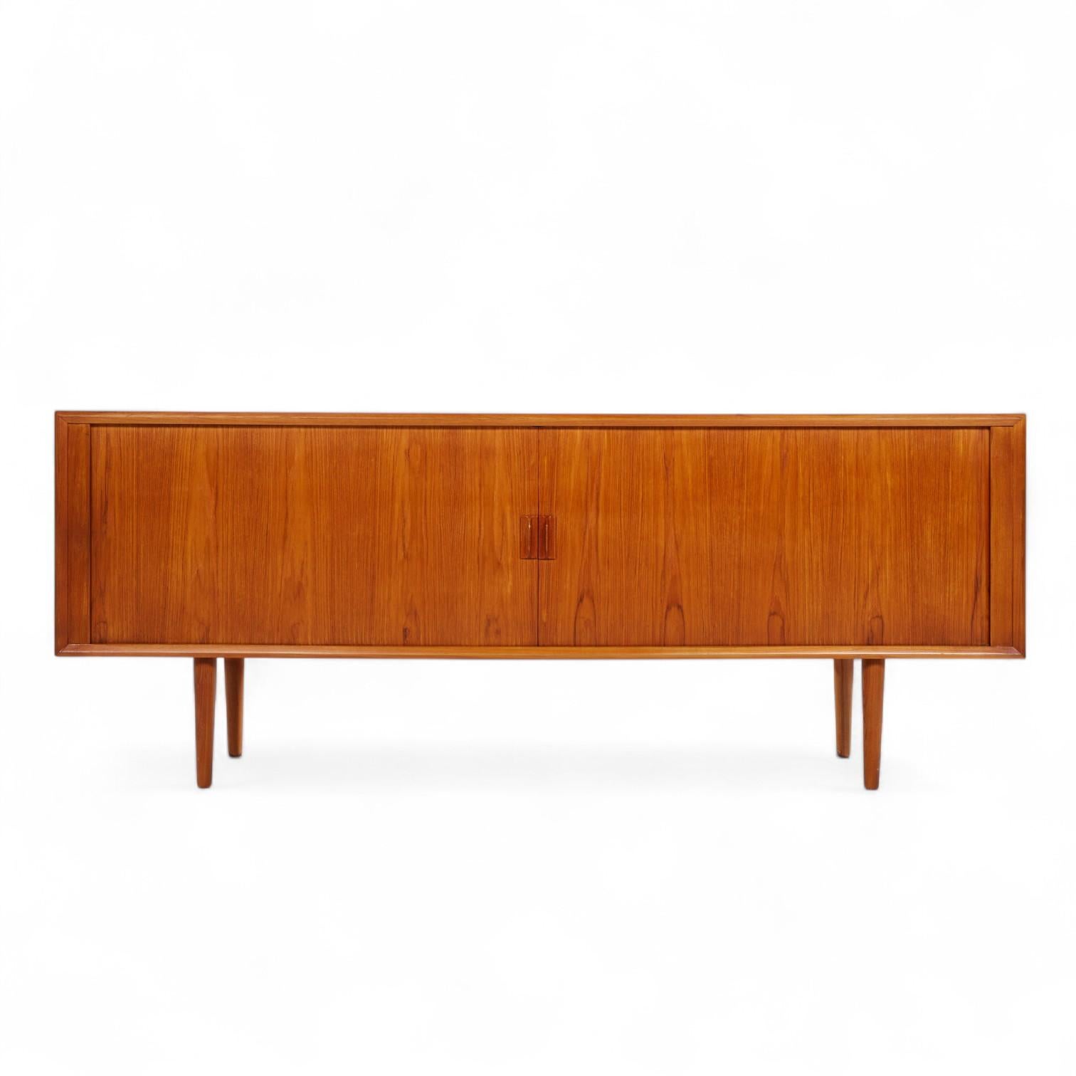 Svend Aage Larsen for Faarup Møbelfabrik Mid Century Danish Teak Tambour Door Credenza with Hutch

This credenza measures: 79.75 wide x 19 deep x 31.5 inches high

All pieces of furniture can be had in what we call restored vintage condition. That