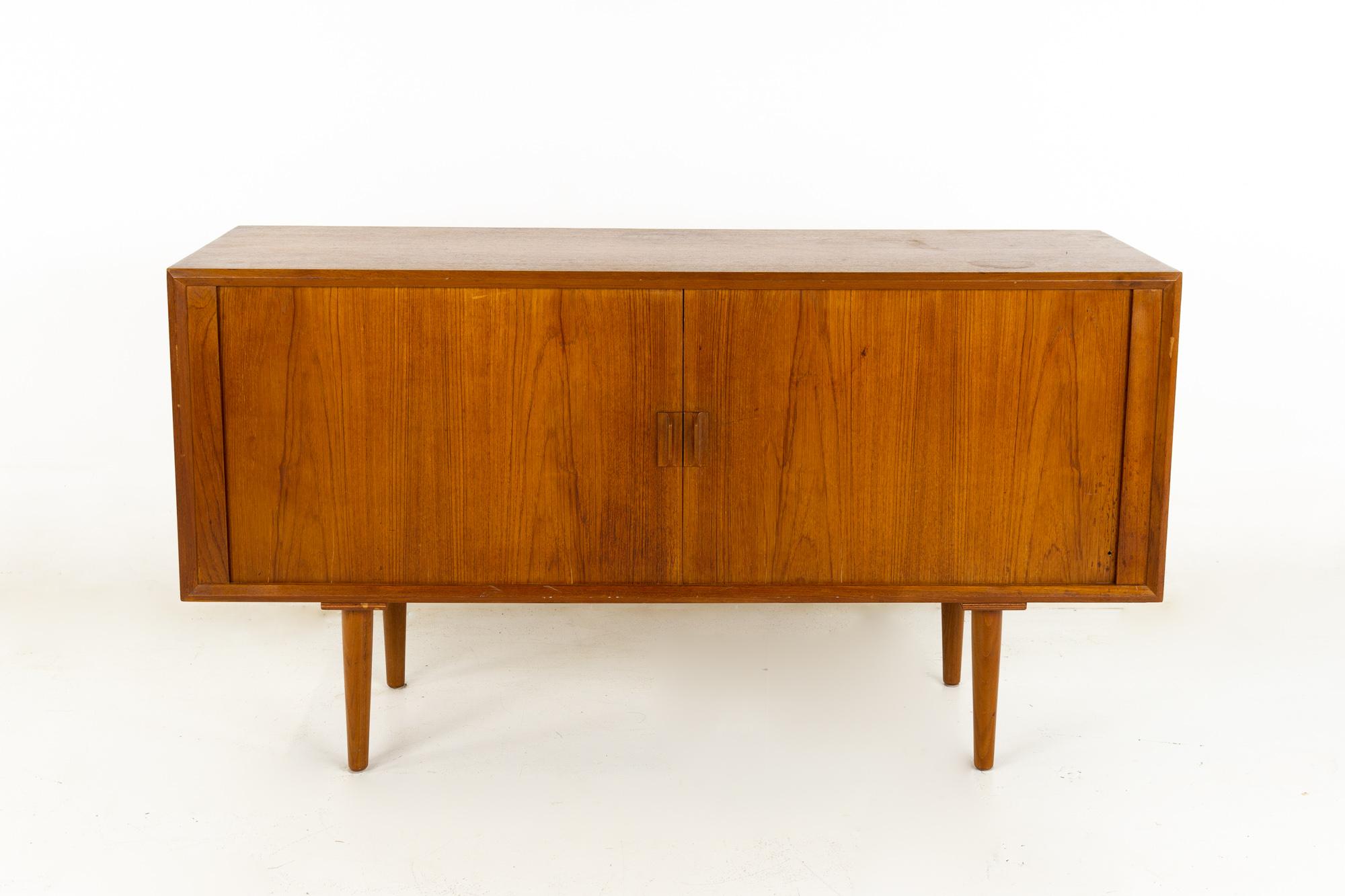 Svend Aage Larsen for Faarup Mobelfabrik mid century Danish teak Tambour door petite sideboard Credenza
This credenza measures: 59 wide x 19 deep x 32 inches high

All pieces of furniture can be had in what we call restored vintage condition.