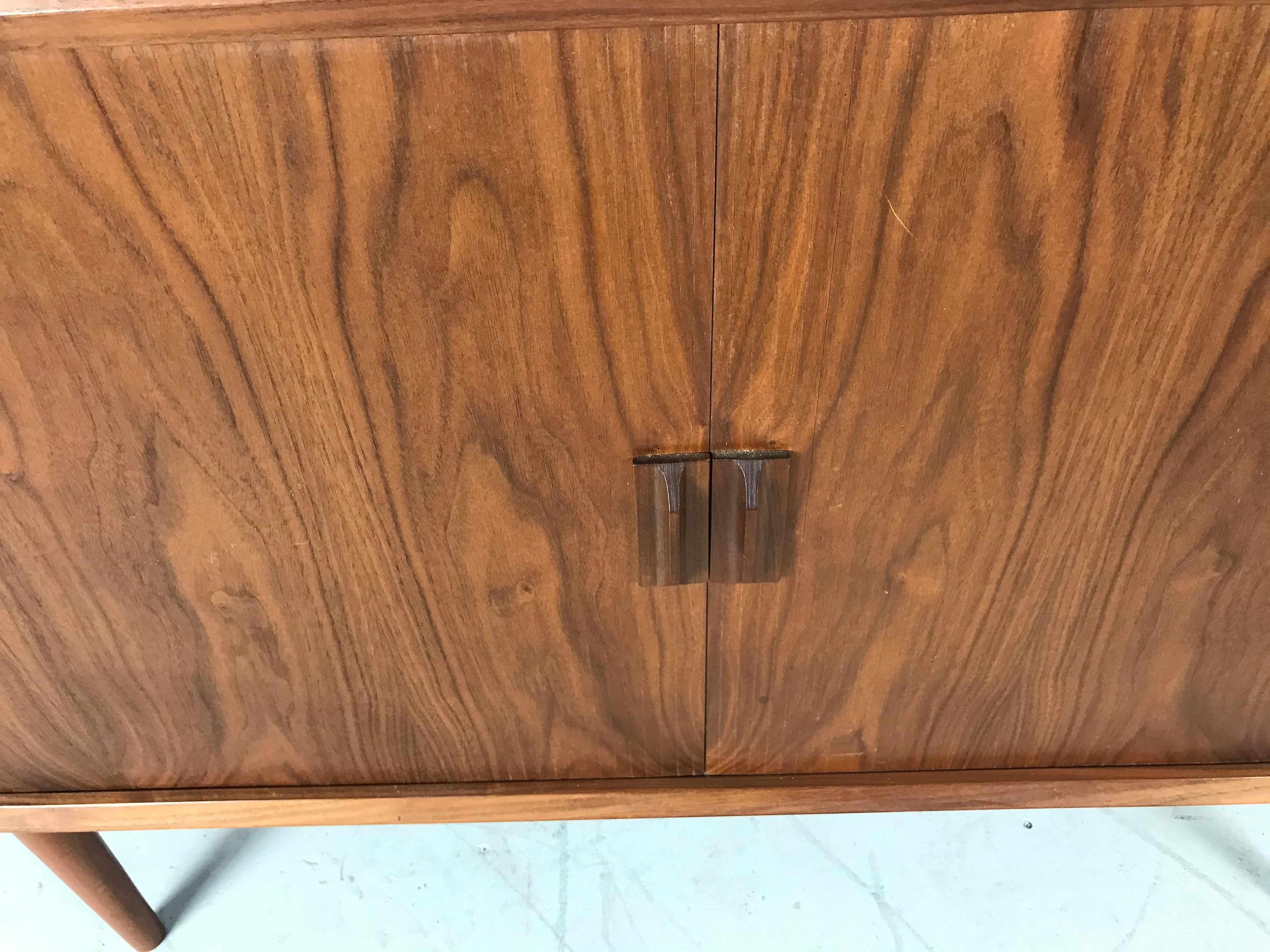 Svend Aage Larsen walnut tambour door credenza for Faarup Mobelfabik, great diminutive size. Denmark, circa 1965. Amazing original condition, wonderful patina, beautiful bookmatched wood graining, finished back, hand delivery avail to New York City