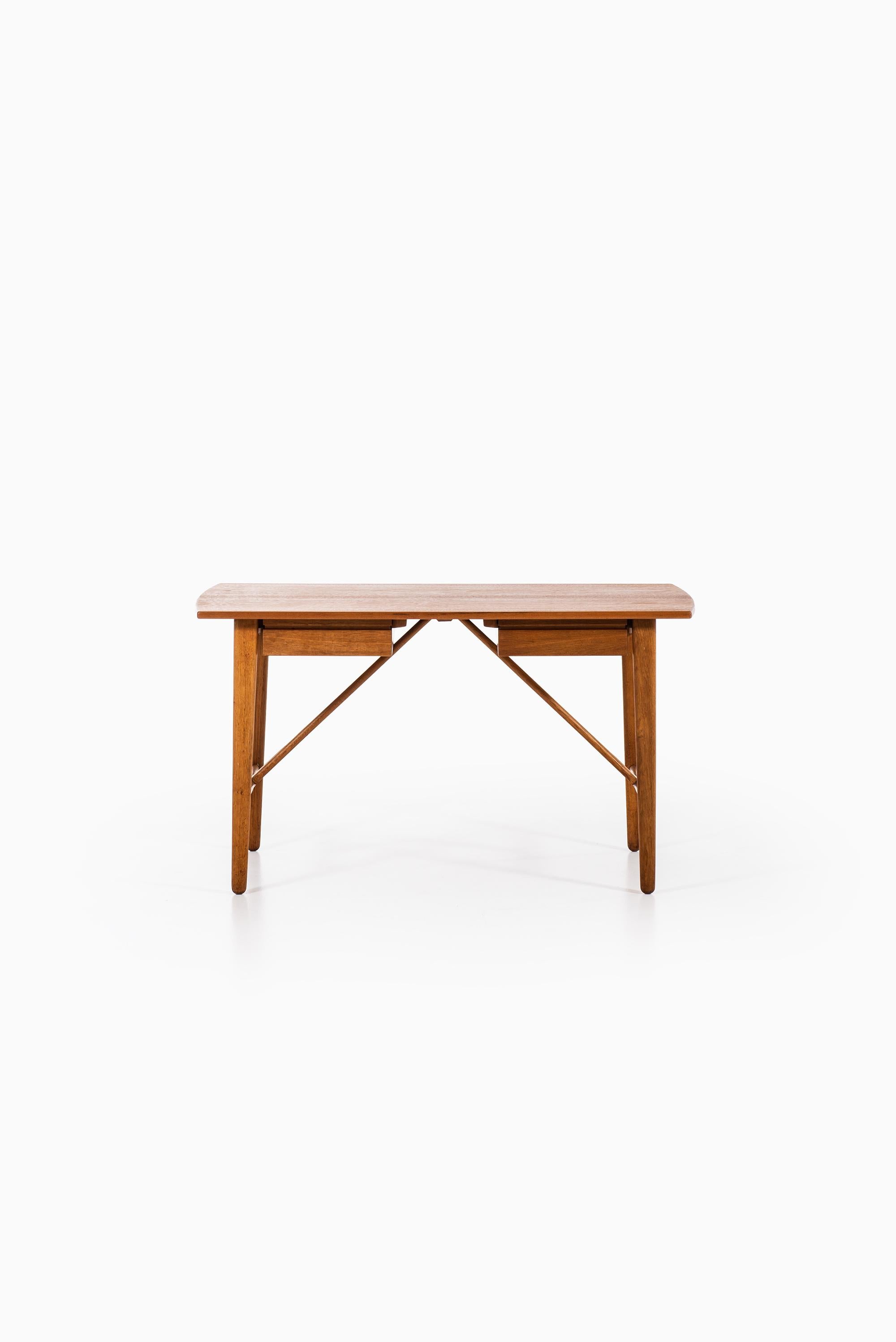 Rare desk designed by Svend Aage Madsen. Produced by K. Knudsen & Søn in Denmark.