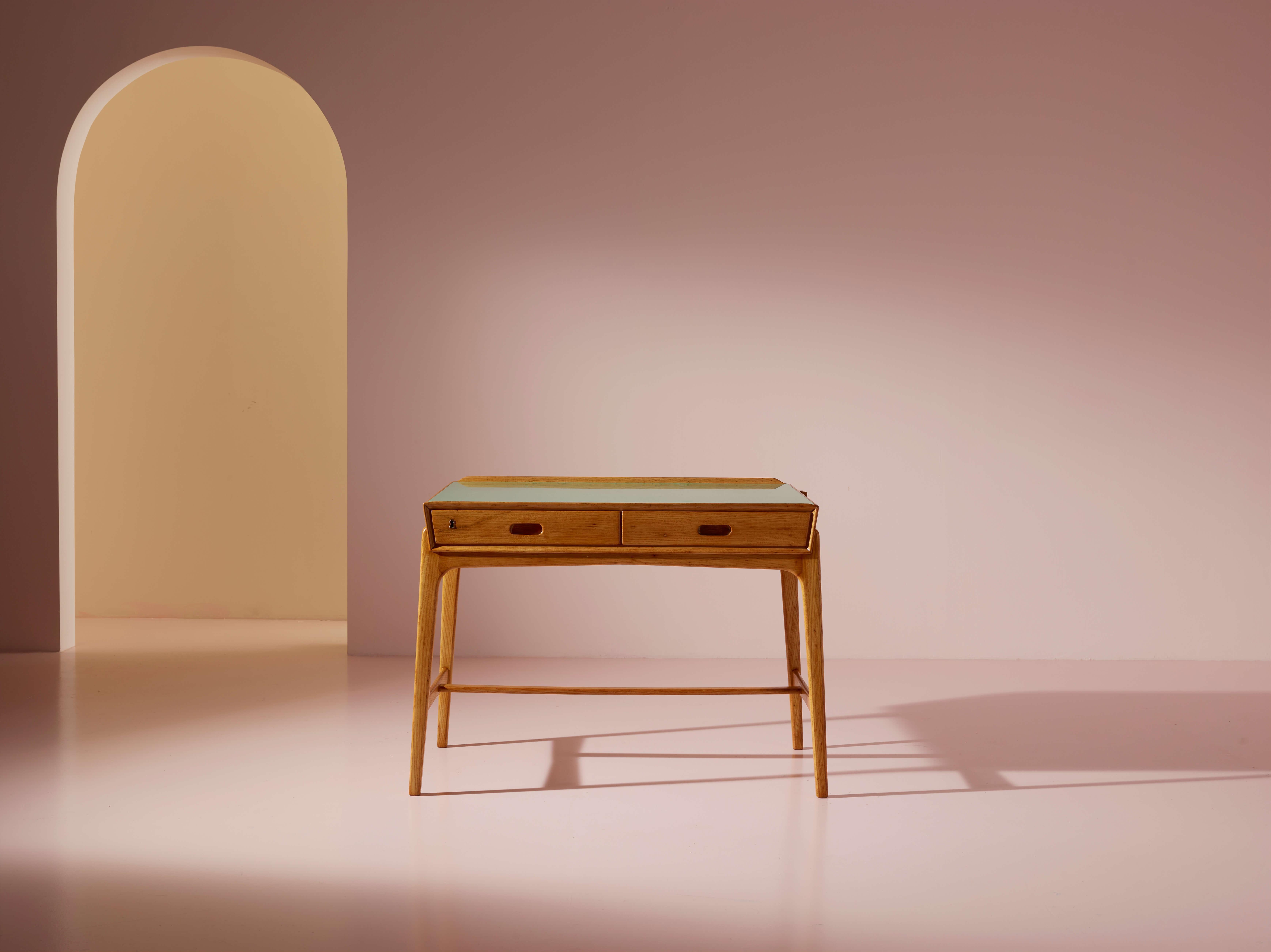 A small desk with two drawers in ash wood and Formica, Danish production, designed by Svend Aage Madsen and produced by Sigurd Hansen, 1958.

Despite its compact size, this desk reflects the Danish design ethos of the time, characterized by