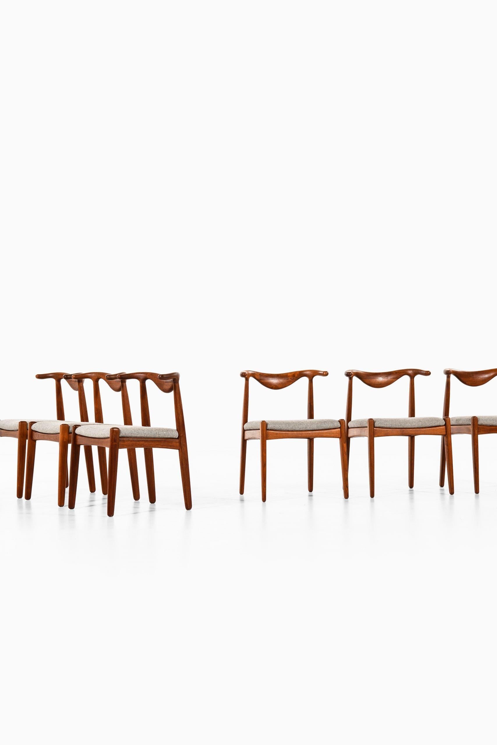 Rare set of 6 cowhorn dining chairs designed by Svend Aage Madsen. Produced by K. Knudsen in Denmark.