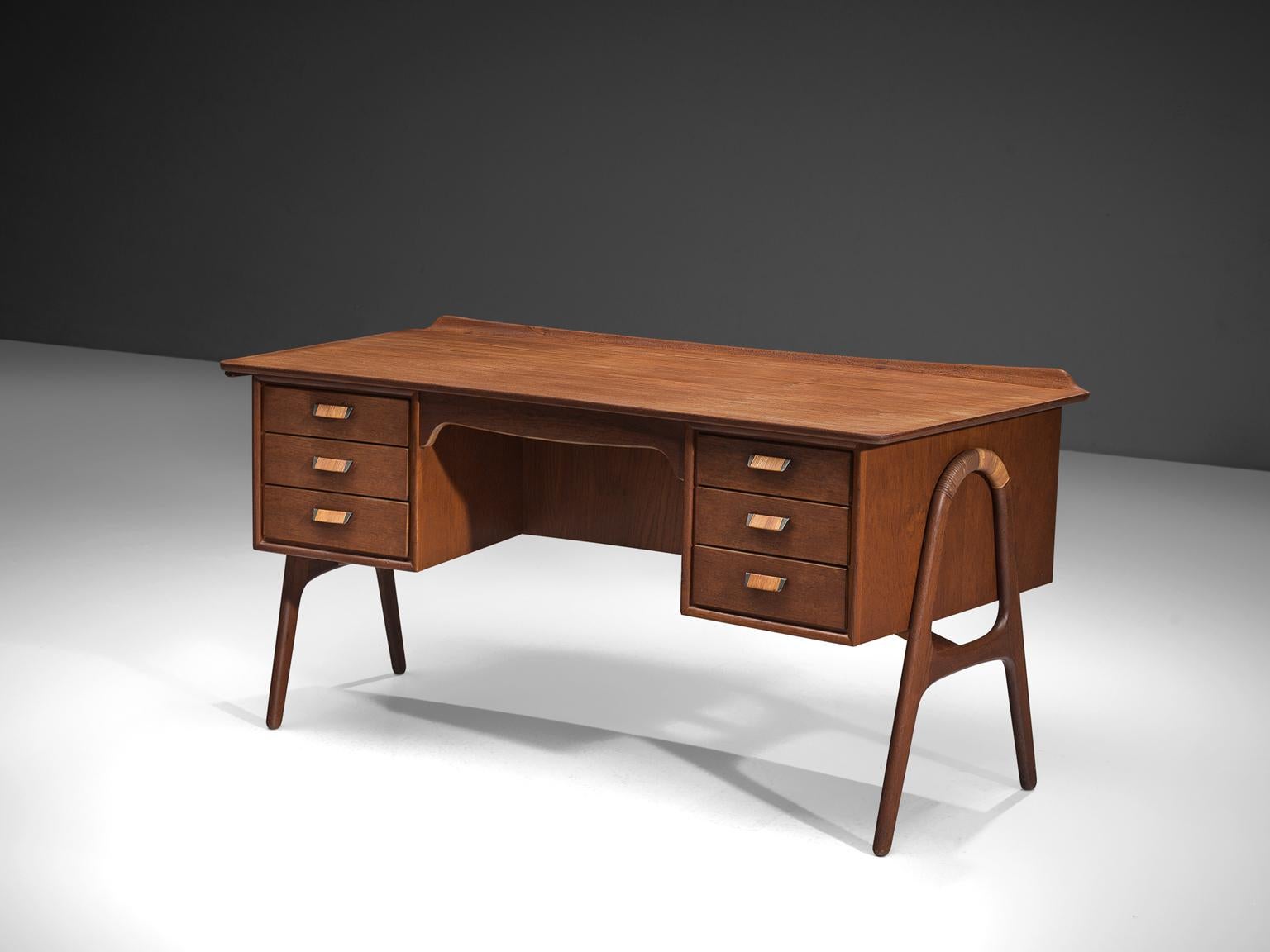 Svend Aage Madsen for Sigurd Hansen, desk, teak, cane, Denmark, 1960s.

This writing table is designed by the Dane Madsen and manufactured by Sigurd Hansen. This ruby colored teak desk features a raised back edge on the top. The double legs are