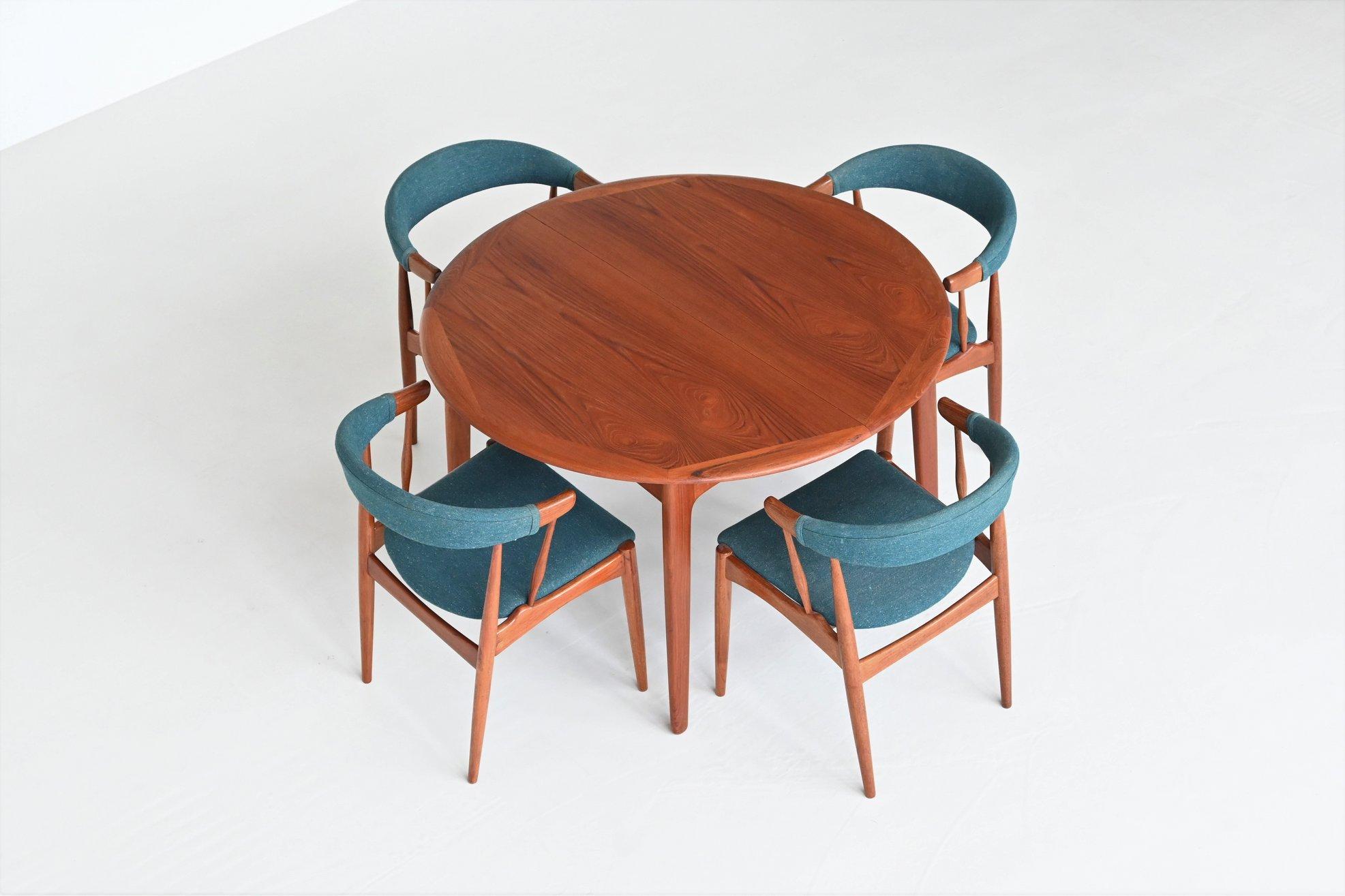 Beautiful shaped extendable dining table designed by Svend Aage Madsen and manufactured by K. Knudsen & Son, Denmark 1960. This table is 115 cm round and extendable using the foldable extension leaves up to a length of 175 cm. The self-storing