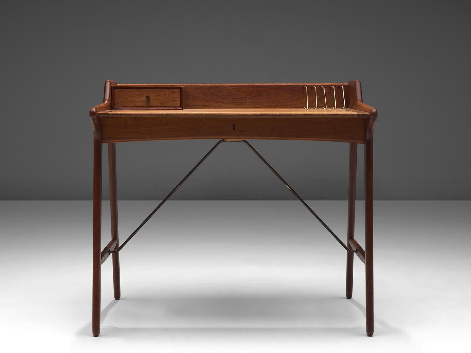 Svend Aage Madsen for K. Knudsen and Son, Desk, brass, teak, Denmark, 1950s.

This refined writing desk is designed by Svend Aage Madsen in the 1950s. The arching top holds a small drawer, and a couple of brass document-holders. Nice and