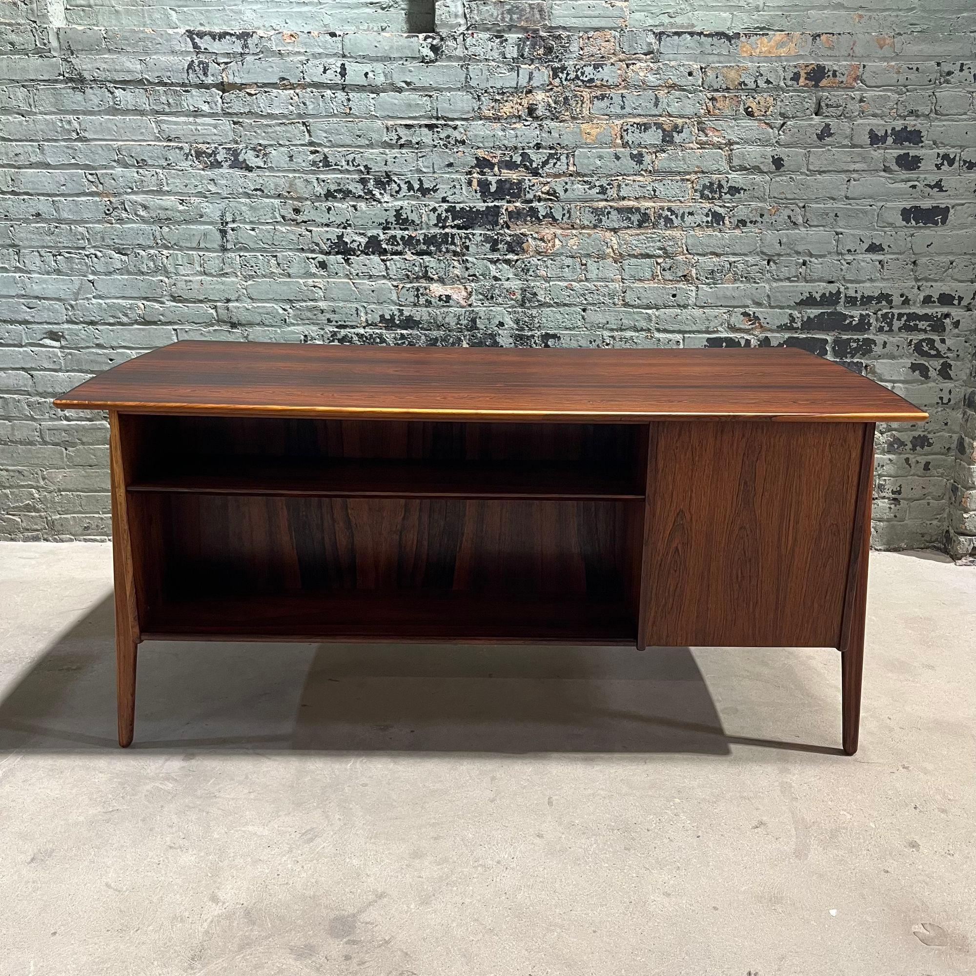 Svend Age Madsen 5 Drawer Rosewood Desk for Sigurd Hansen 1960. Gorgeous desk, been restored.
Measures 61.25