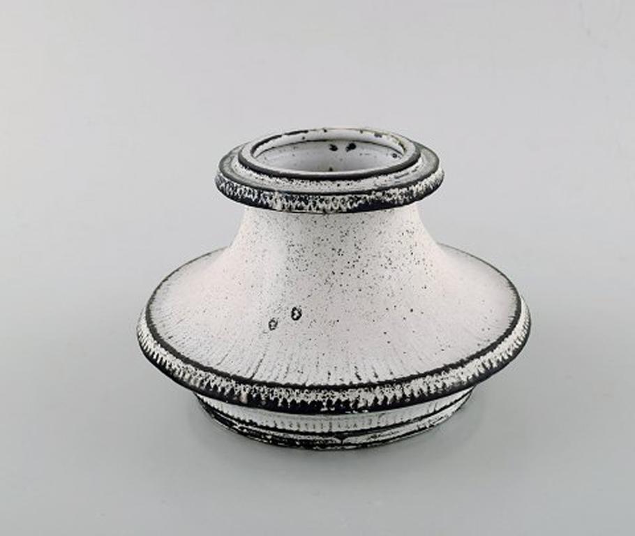 Svend Hammershøi for Kähler, Denmark, large candleholder in glazed stoneware.
In perfect condition. 1930s-1940s.
Beautiful black / grey double glaze.
Stamped.
Measures: 16 x 10.5 cm.
  