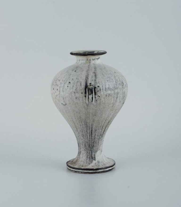 Svend Hammershøi for Kähler. Vase in glazed stoneware.
Beautiful grey-black double glaze.
1930s/40s.
Signed, HAK.
In excellent condition.
Measurements: D 13.0 x H 19.0 cm.