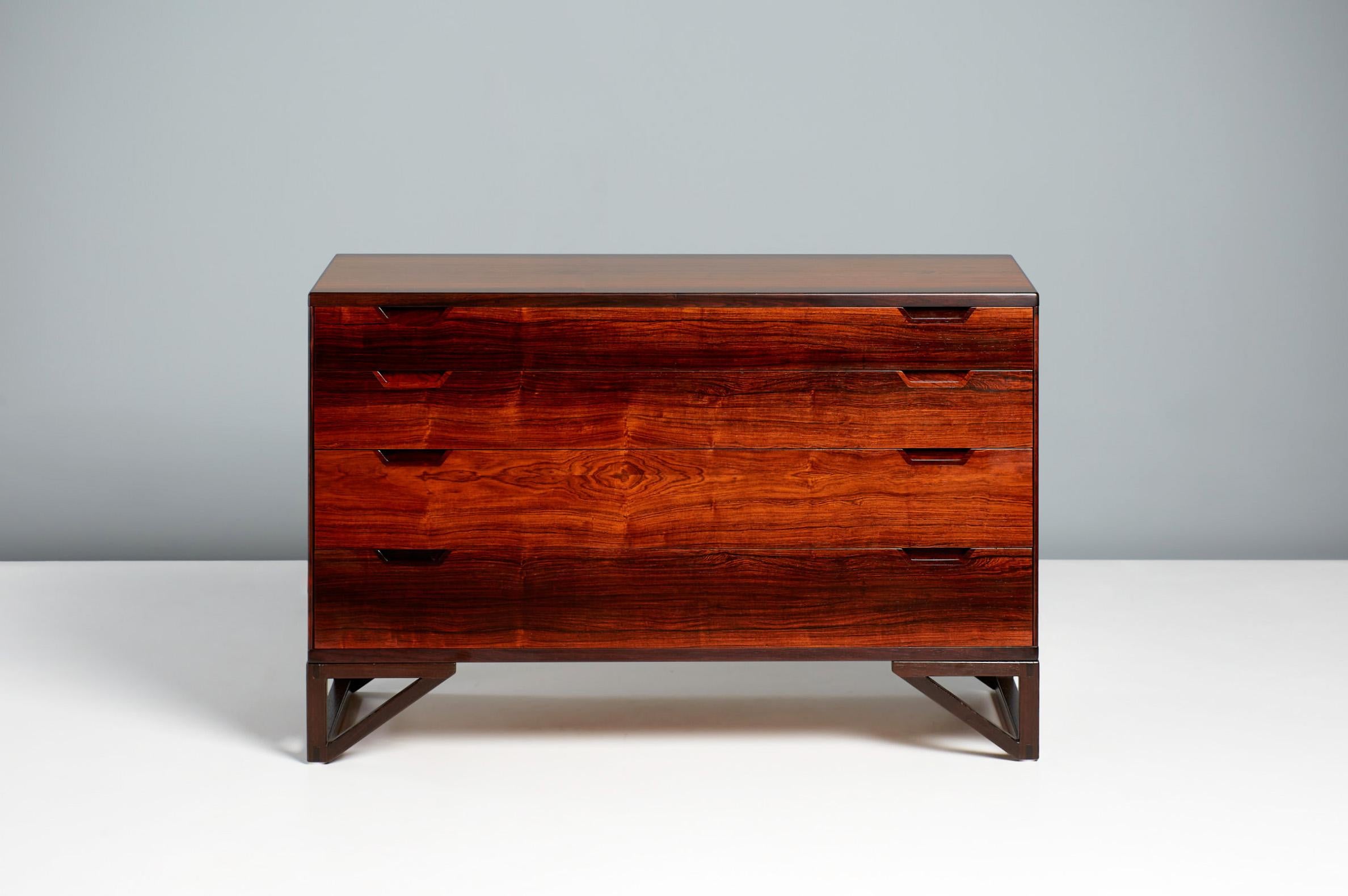 Svend Langkilde - Chest of Drawers, c1960s

An exquisite chest of drawers made from solid and veneered rosewood, designed by Sven Langkilde and produced by his own company Langkilde Mobler in Denmark. The drawer liners are made from mahogany. The