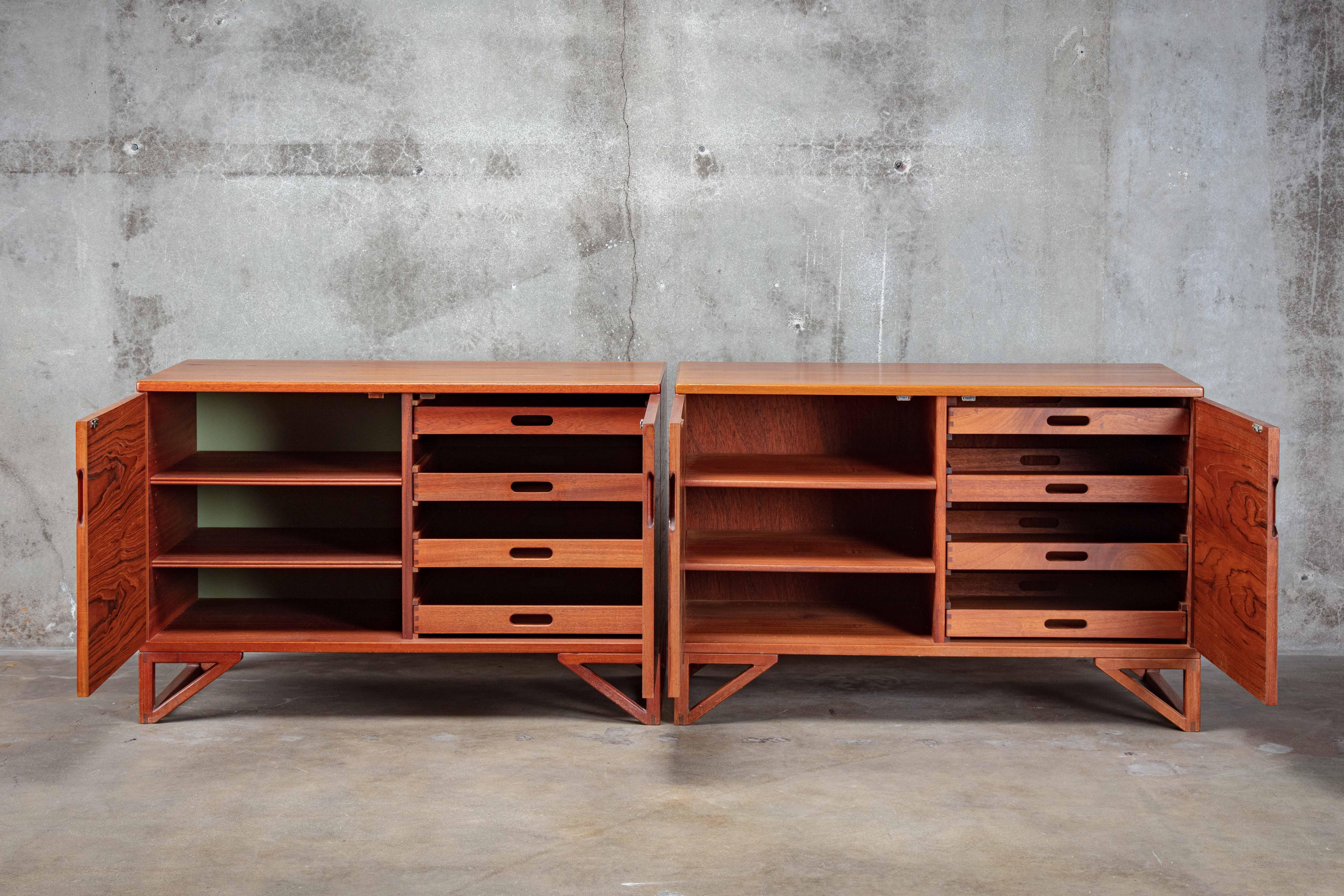 Svend Langkilde pair of teak cabinets mounted on runner legs manufactured by Langkilde Mobler.