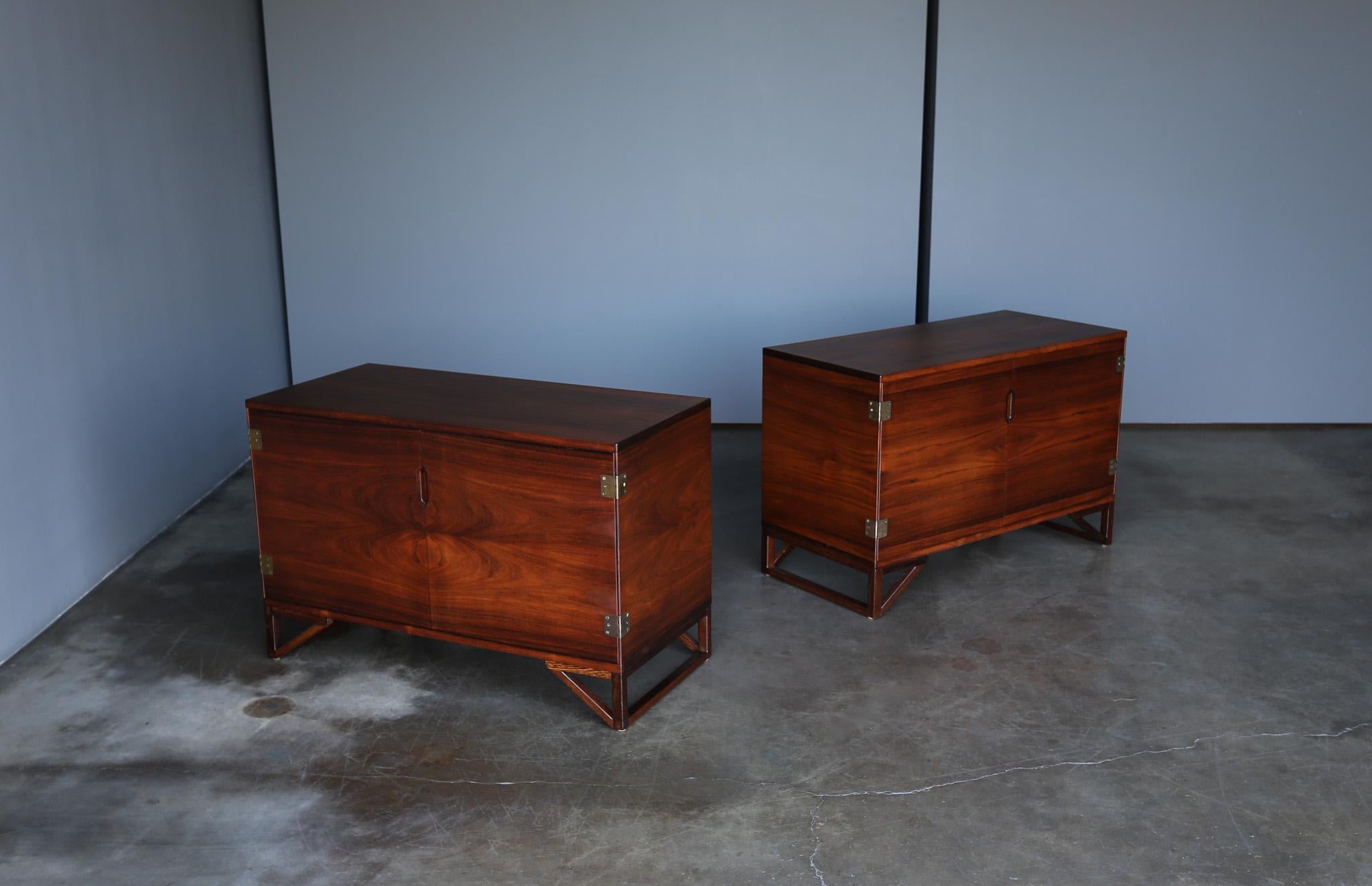 Svend Langkilde Rosewood Cabinets for Langkilde Møbler, Denmark, c.1960.  This design was retailed by Illums Bolighus.  Beautiful rosewood grain.  This pair has been professionally restored.  