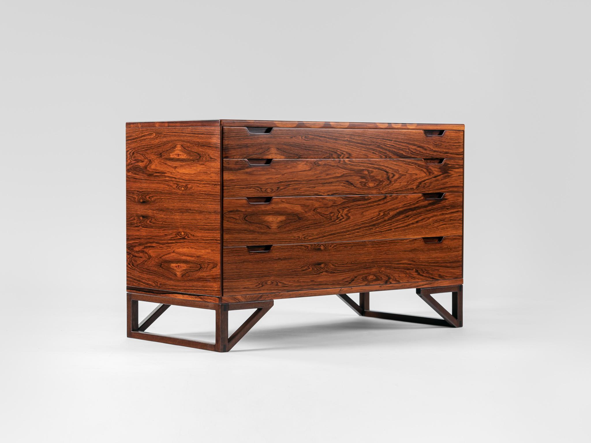 Beautiful Chest of drawers made from exquisite rosewood designed by Svend Langkilde and produced by Langkilde Mobler. 

With 4 drawers with different heights and the 1st drawers with dividers. 


