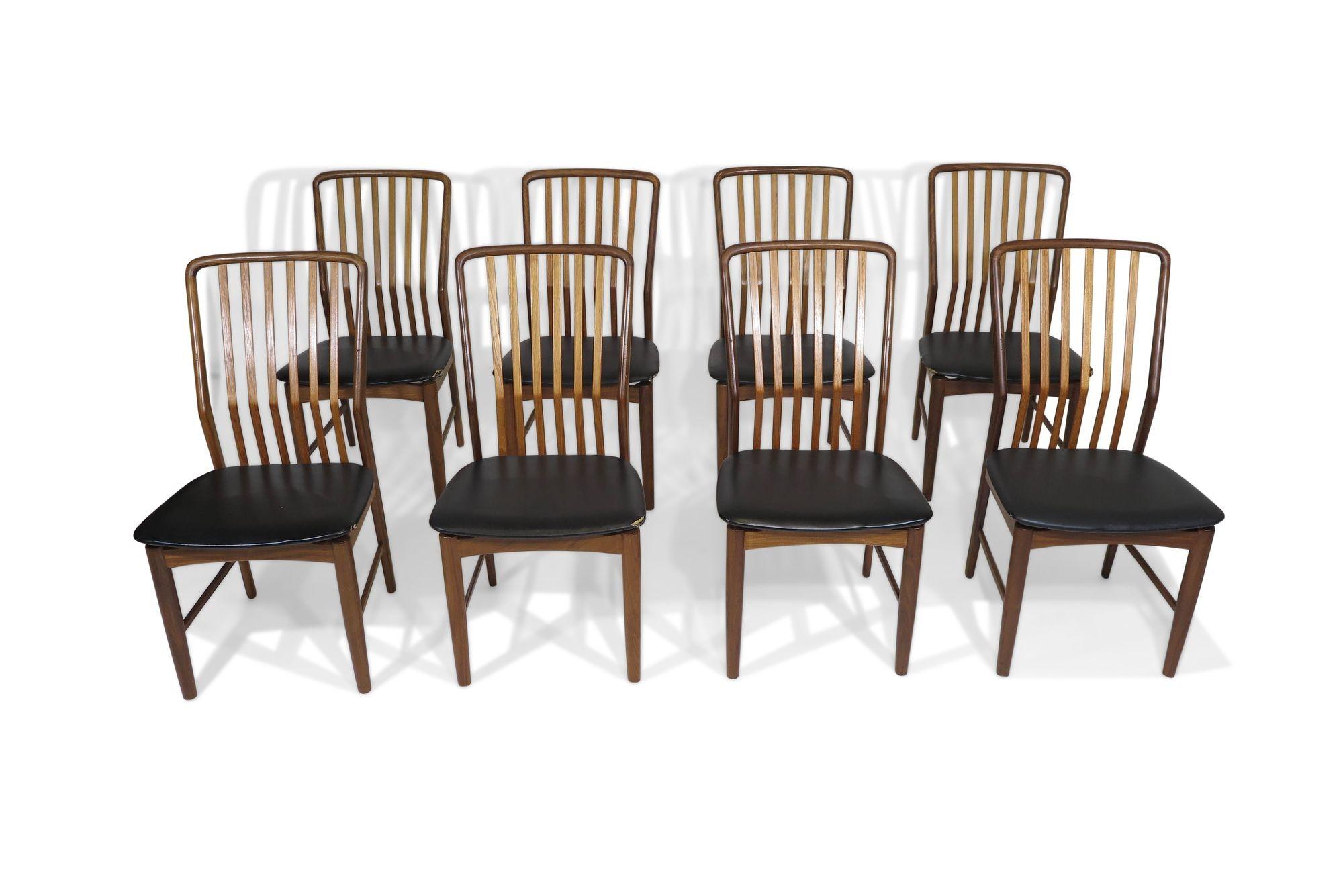 Stylish set of eight high-back dining chairs designed by Svend A Madsen for Moreddi ,1960, Denmark. The 8 chair frames are crafted of solid walnut with angled, slatted back rests, designed for ergonomics and offering comfortable lumbar support. The