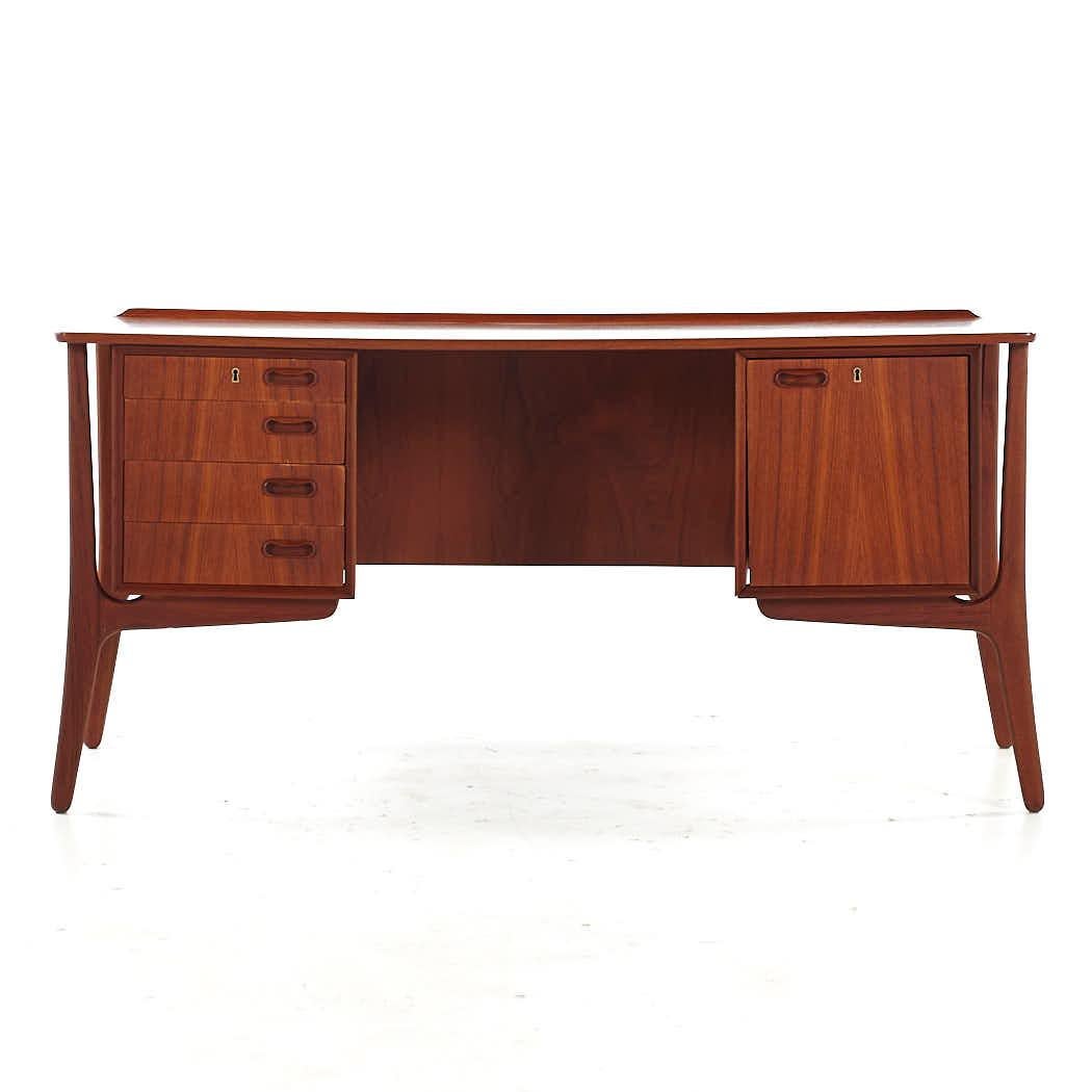 Svend Madsen Mid Century Danish Teak Desk

This desk measures: 60 wide x 29 deep x 28 high, with a chair clearance of 27 inches

All pieces of furniture can be had in what we call restored vintage condition. That means the piece is restored upon
