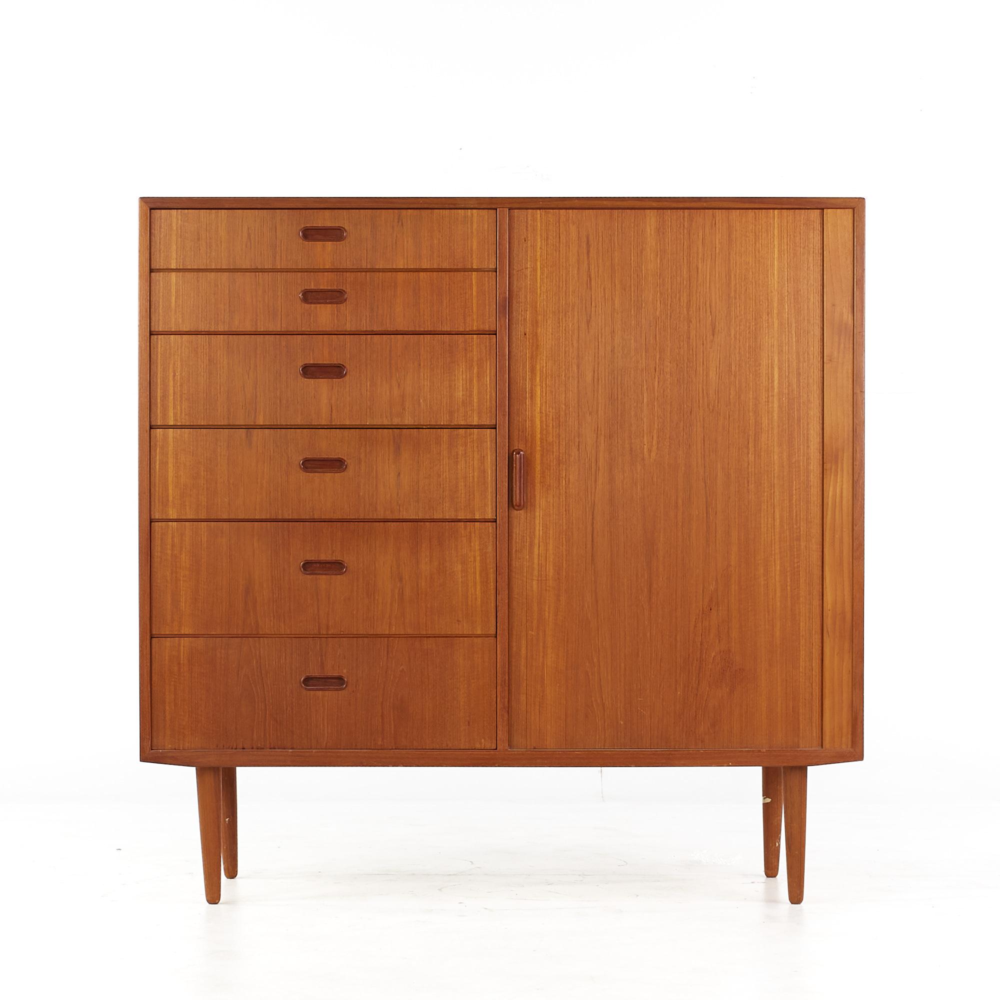 Svend Madsen style falster mid century teak tambour door gentlemans chest

This gentlemans chest measures: 48 wide x 17.75 deep x 47 inches high

All pieces of furniture can be had in what we call restored vintage condition. That means the piece
