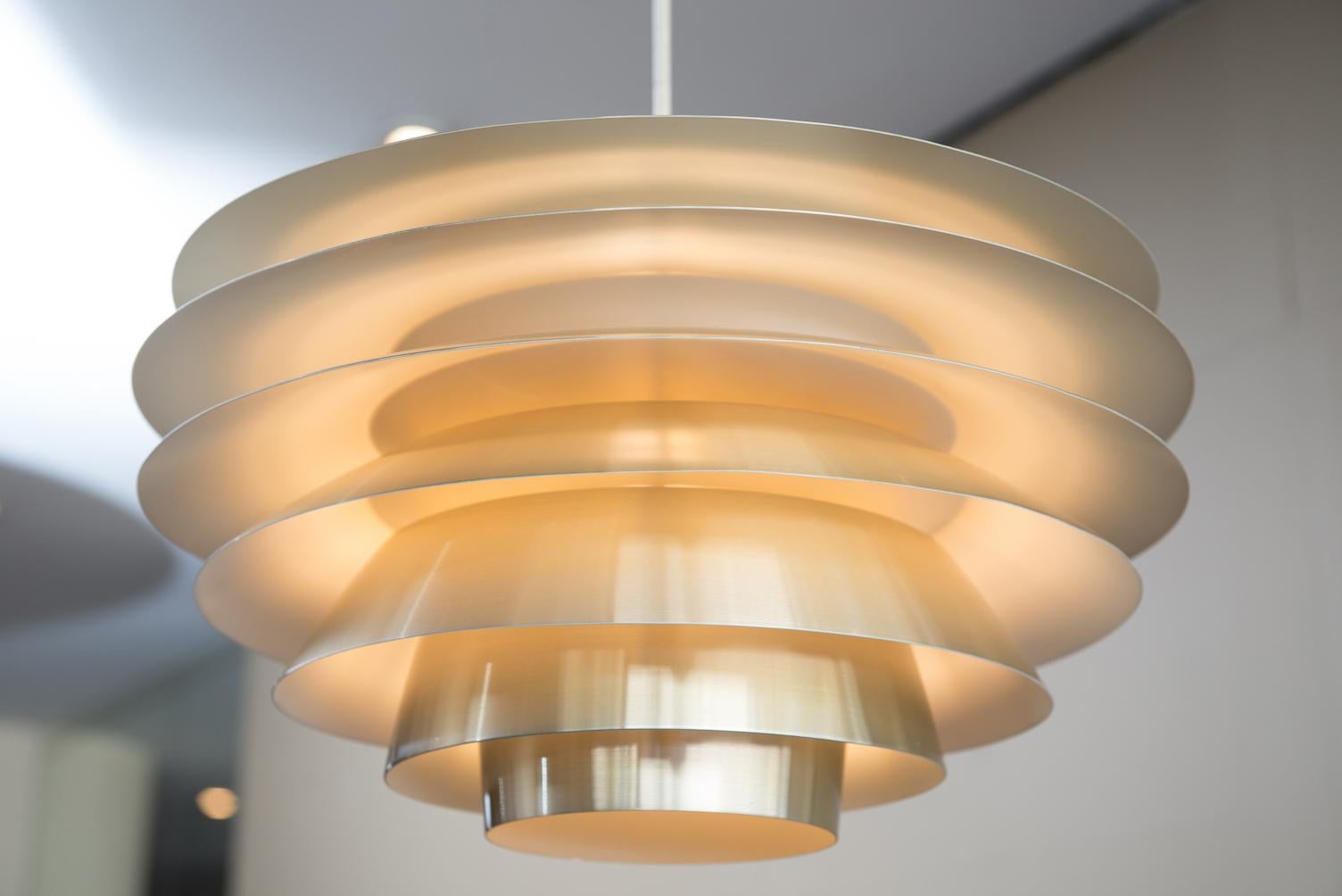 Verona model ceiling lamp in brass color anodized aluminium.