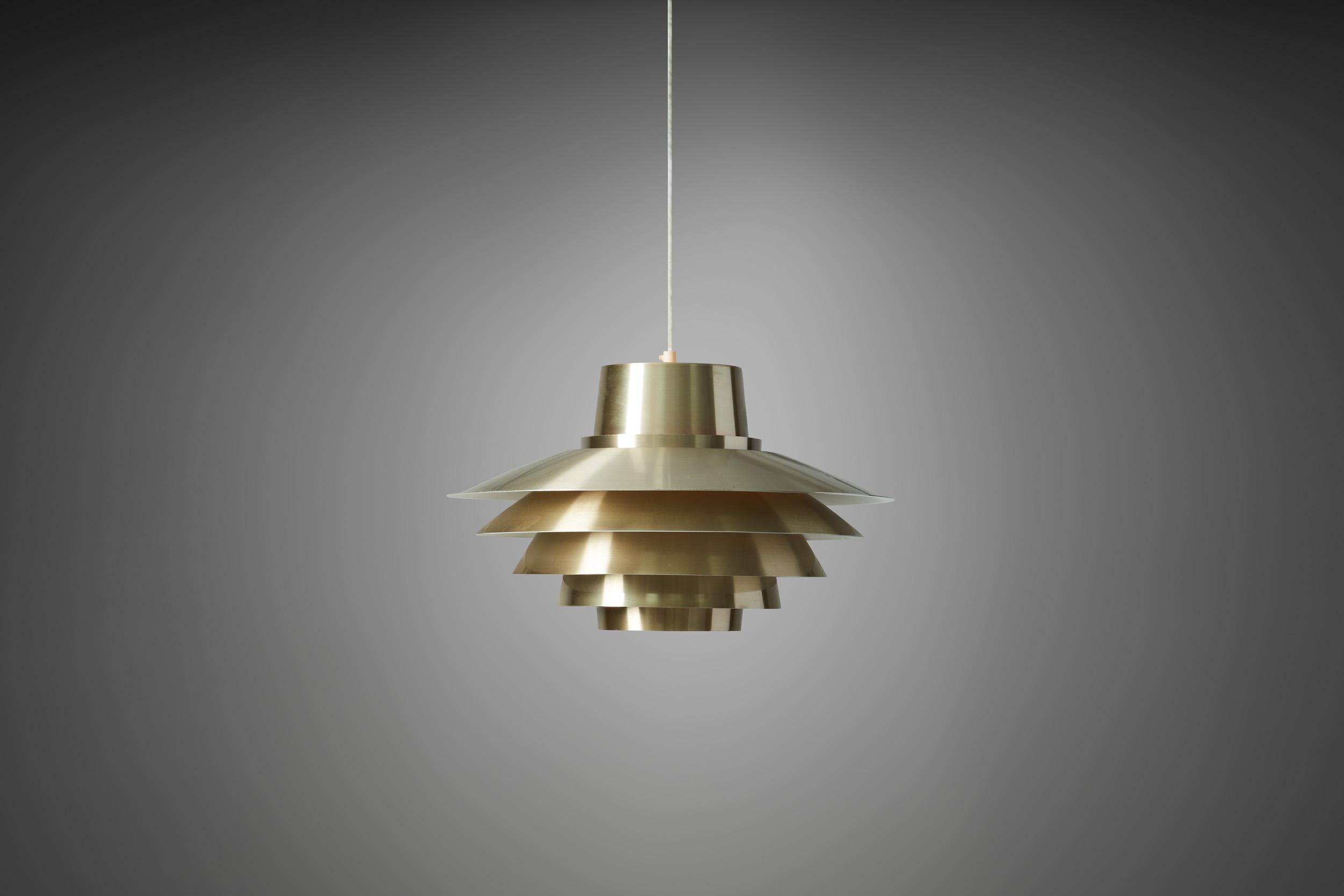The “Verona” pendant is easily one of the most recognizable lighting designs of the Scandinavian mid-century. Its layered look is unmistakeable and became synonymous with Svend Middelboe. 

The manufacturer, Nordisk Solar Compagni Lights, won a