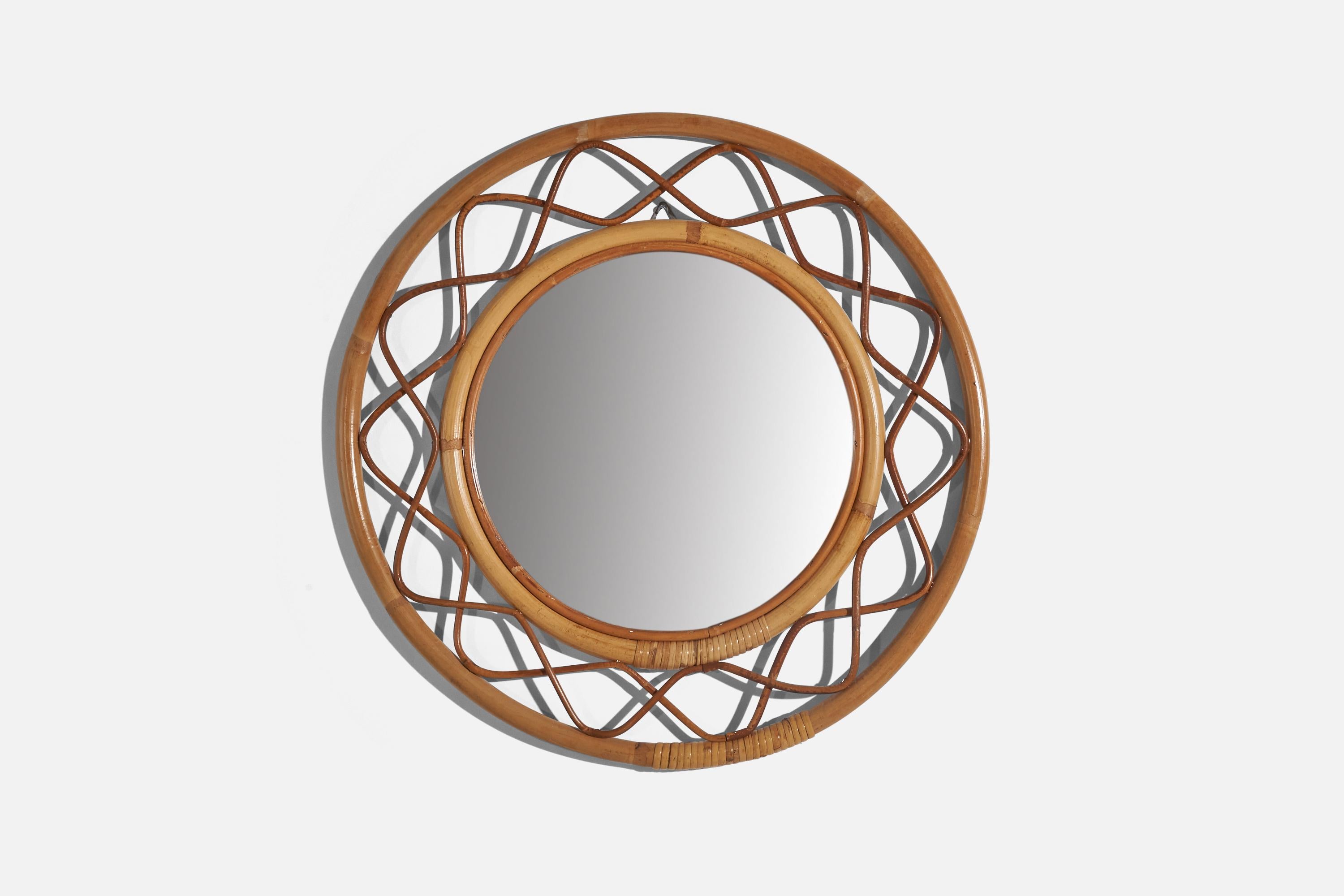A wicker and bamboo wall mirror designed and produced by Svenskt Tenn, Sweden, 1950s. 