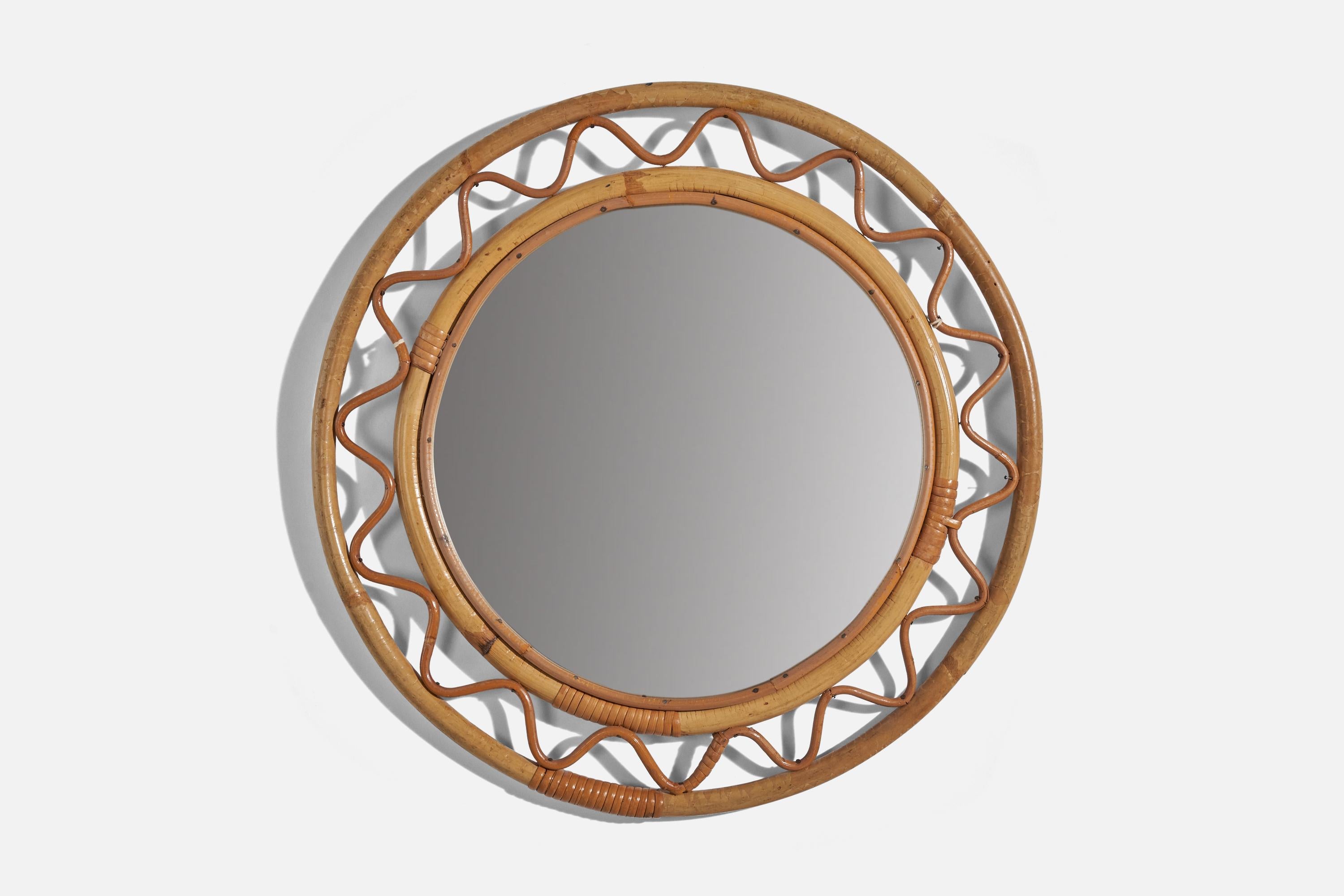 A bamboo and woven wicker wall mirror designed and produced by Svenskt Tenn, Sweden, 1950s. 