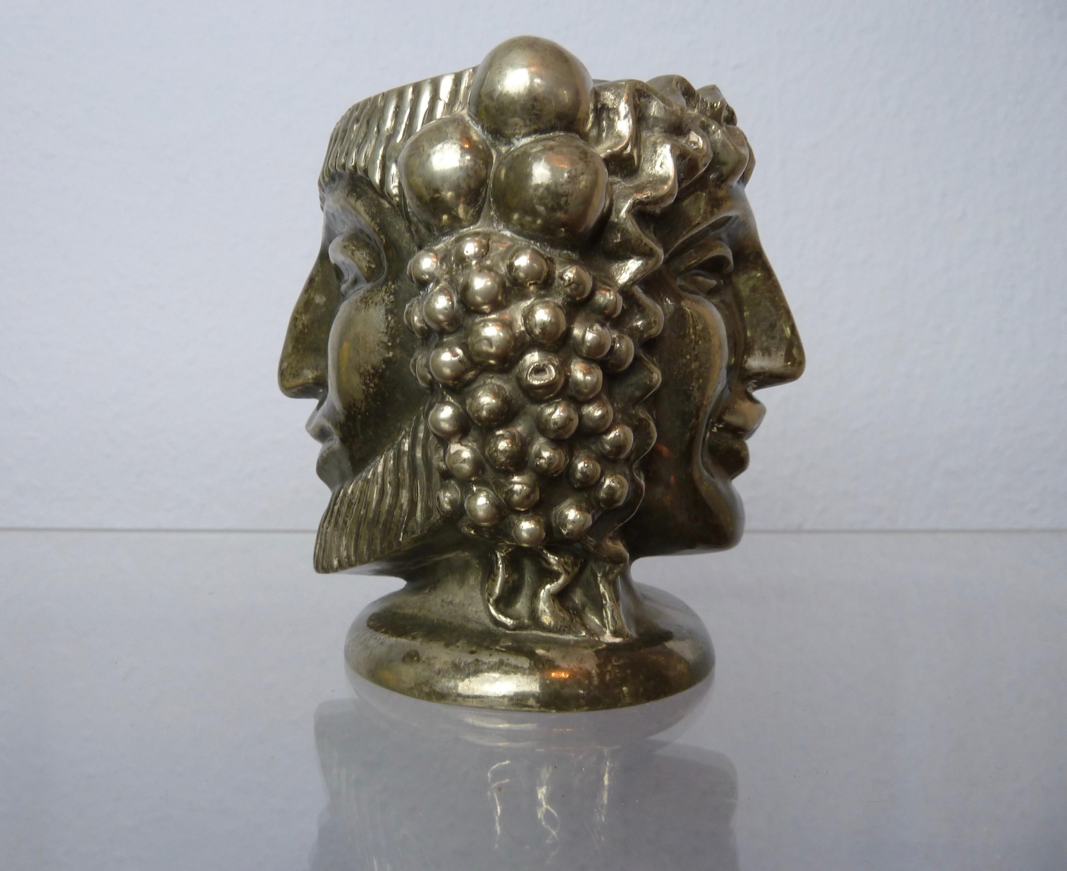 A Svenskt Tenn pewter vase Janus /Janushuvud by Anna Petrus, Sweden.

Designed in 1927 by Anna Petrus, manufactured in 1984.
This version is from a better quality and better detailed than most of the later examples.