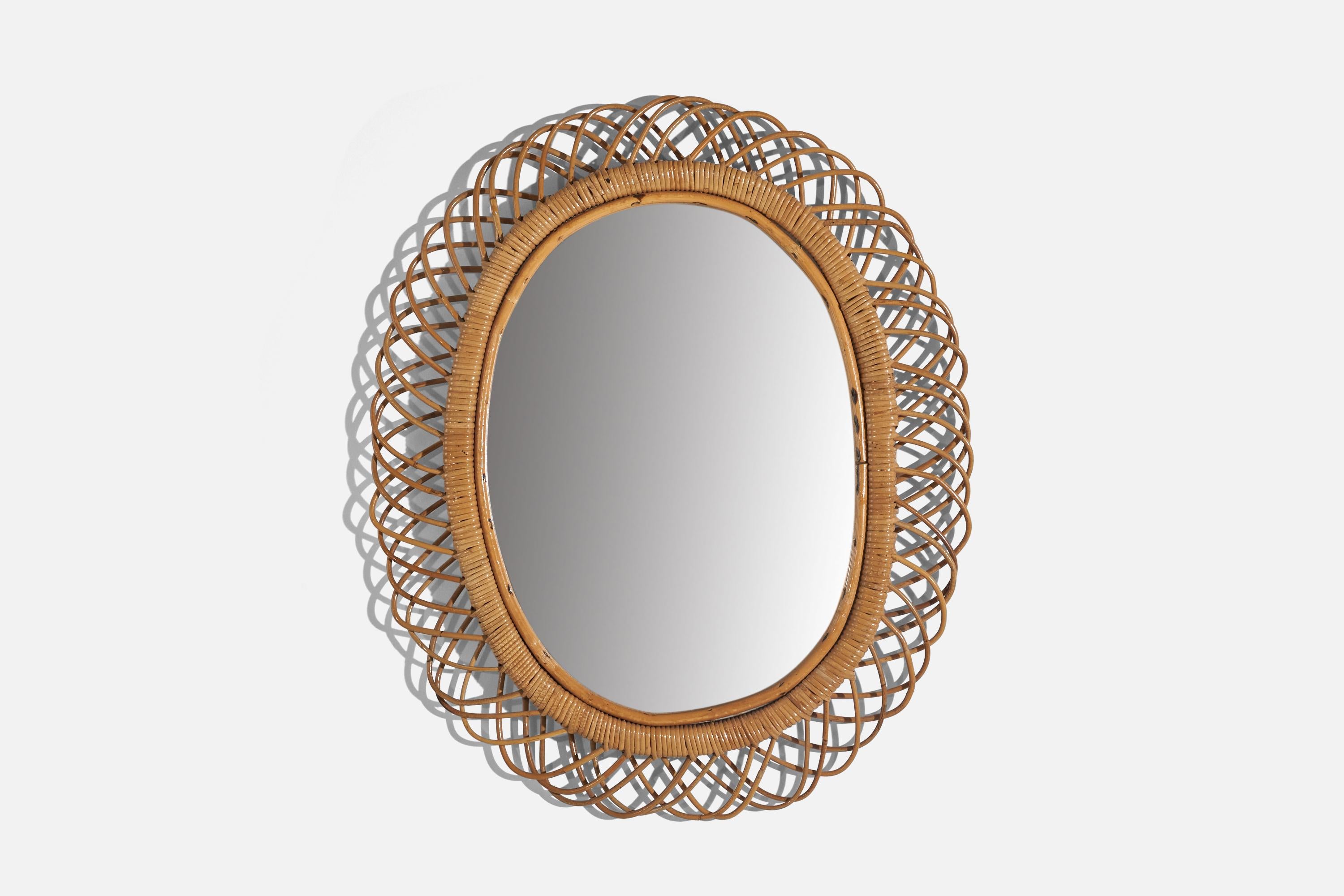A rattan and bamboo wall mirror designed and produced by Svenskt Tenn, Sweden, 1950s. 