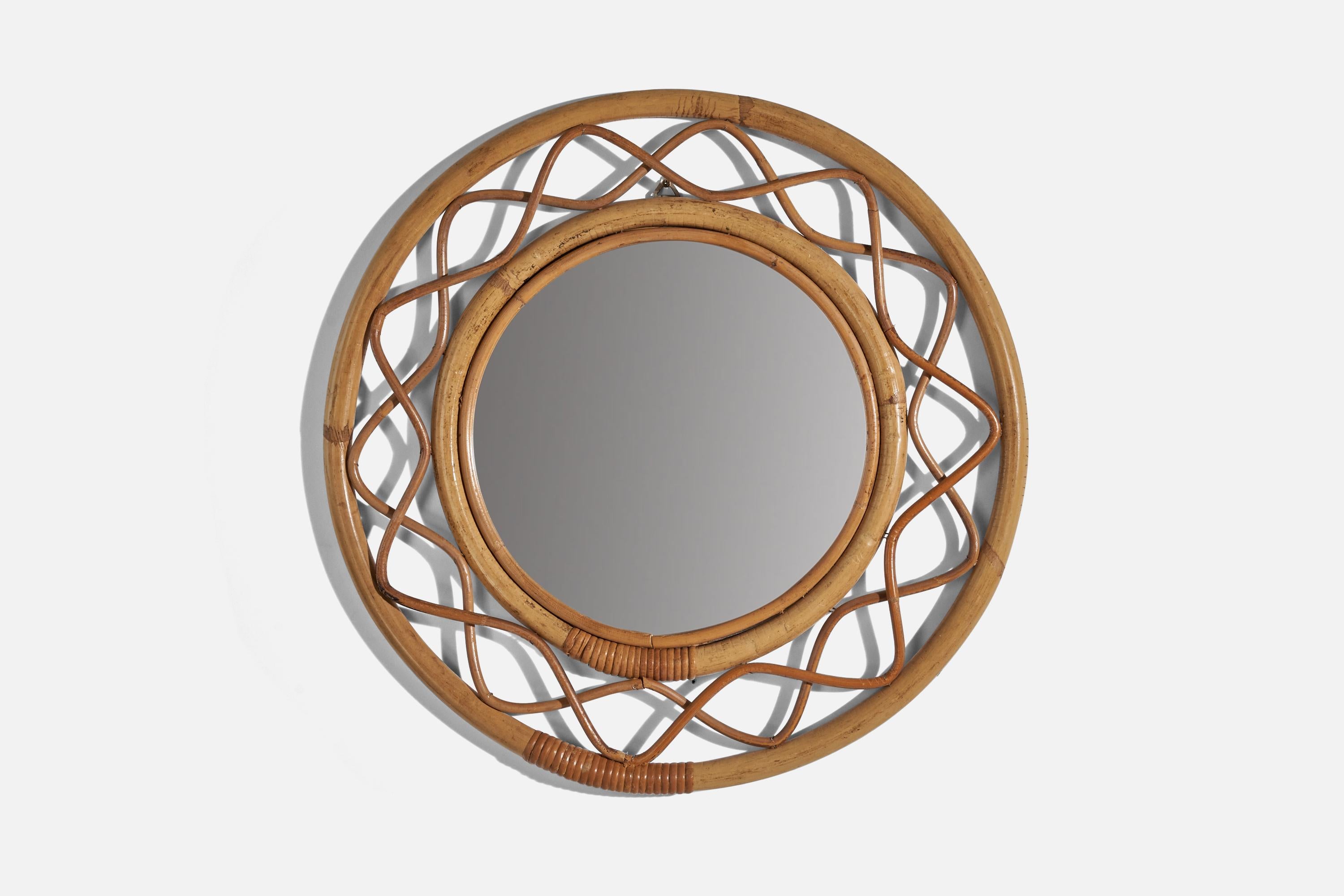 A bamboo and wicker wall mirror designed and produced by Svenskt Tenn, Sweden, 1950s. 