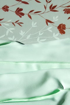 Golden branch on a mint green background. 3D textured.