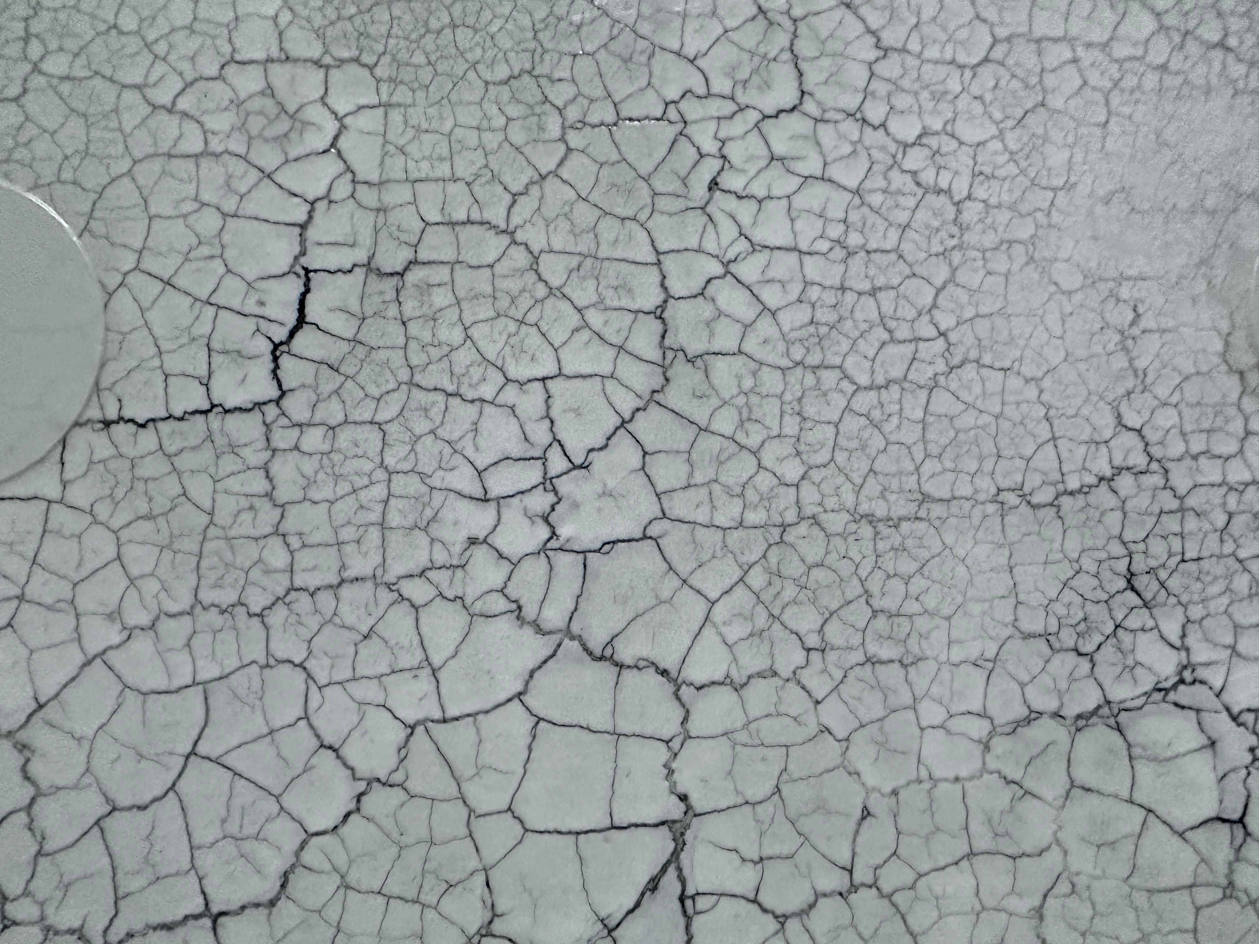 This incredible large scale contemporary piece is an original by the late Svetlana Shalygina. It showcases artist’s unique technique in creating texture and depth using mixed media. The crackle pattern is subtly disrupted by stenciled dots, which
