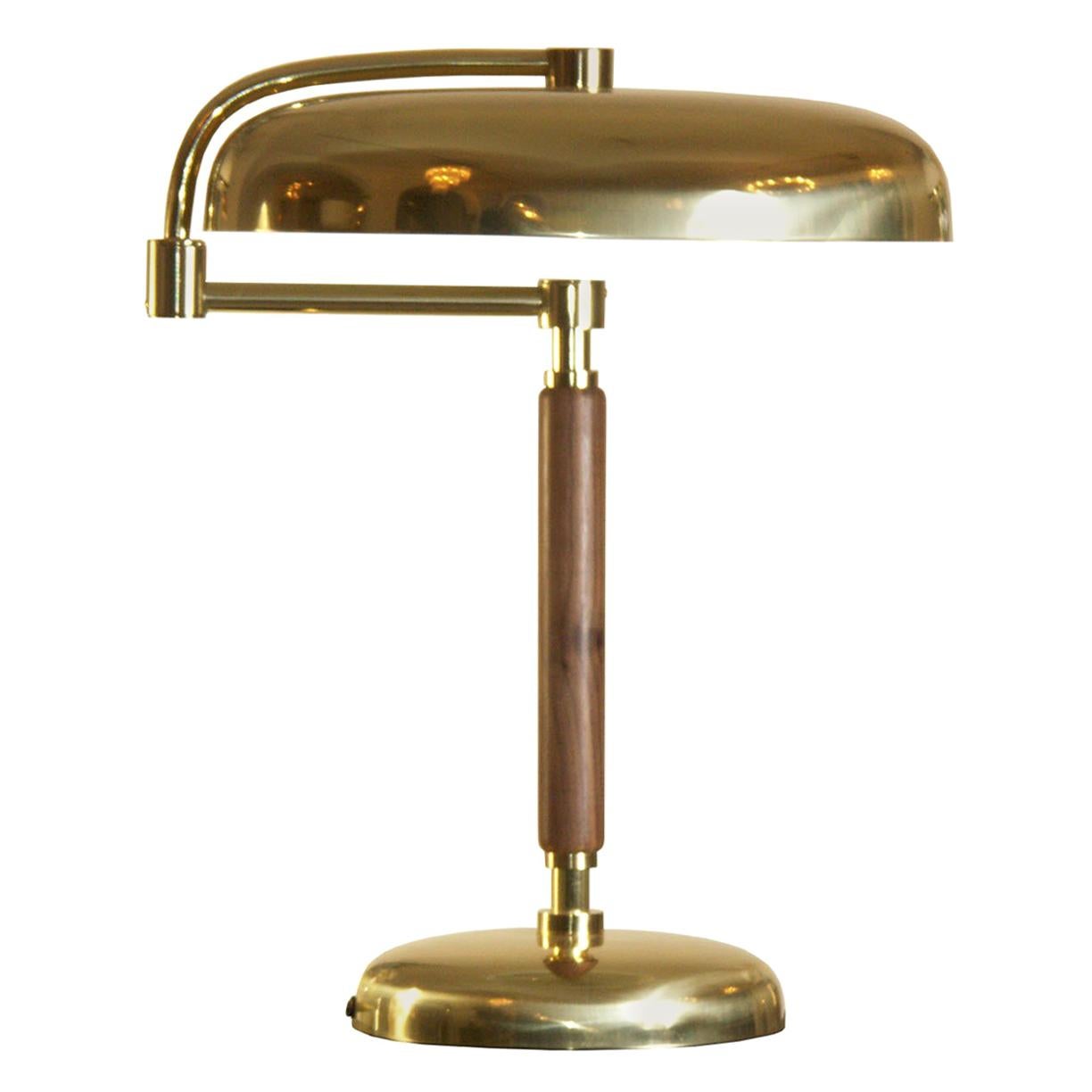 Very elegant timeless desk lamp. Very heavy base, sviveling shade
Brass nickel-plated - stem in black laquered beechwood, other finishes as well.

Most components according to the UL regulations, with an additional charge we will UL-list and label