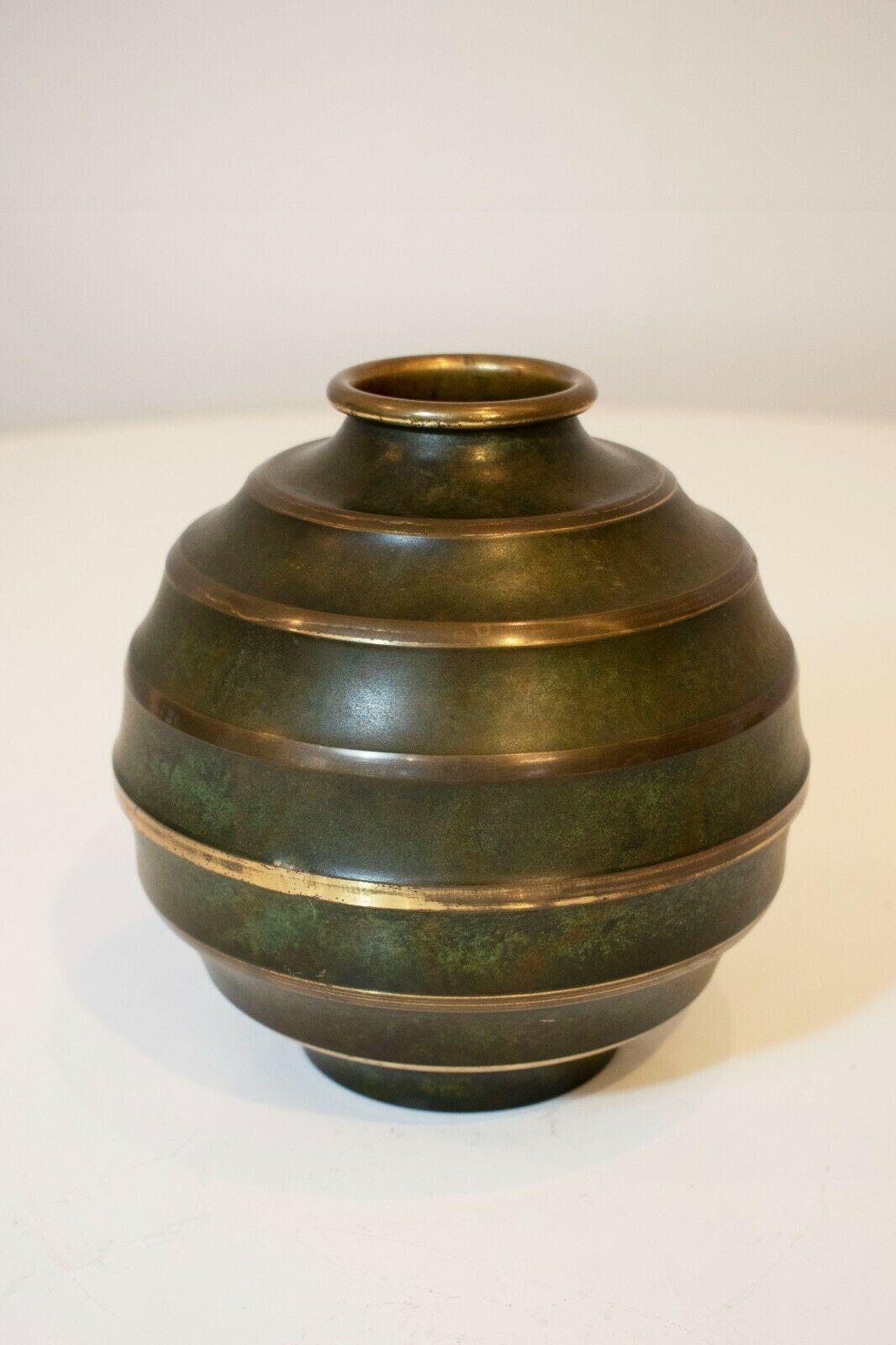 A beautiful and rare Art Deco Bronze vase by SVM Handarbete, Sweden, 1930's. 

This vase has an exquisite patina with logo engraving to the base.