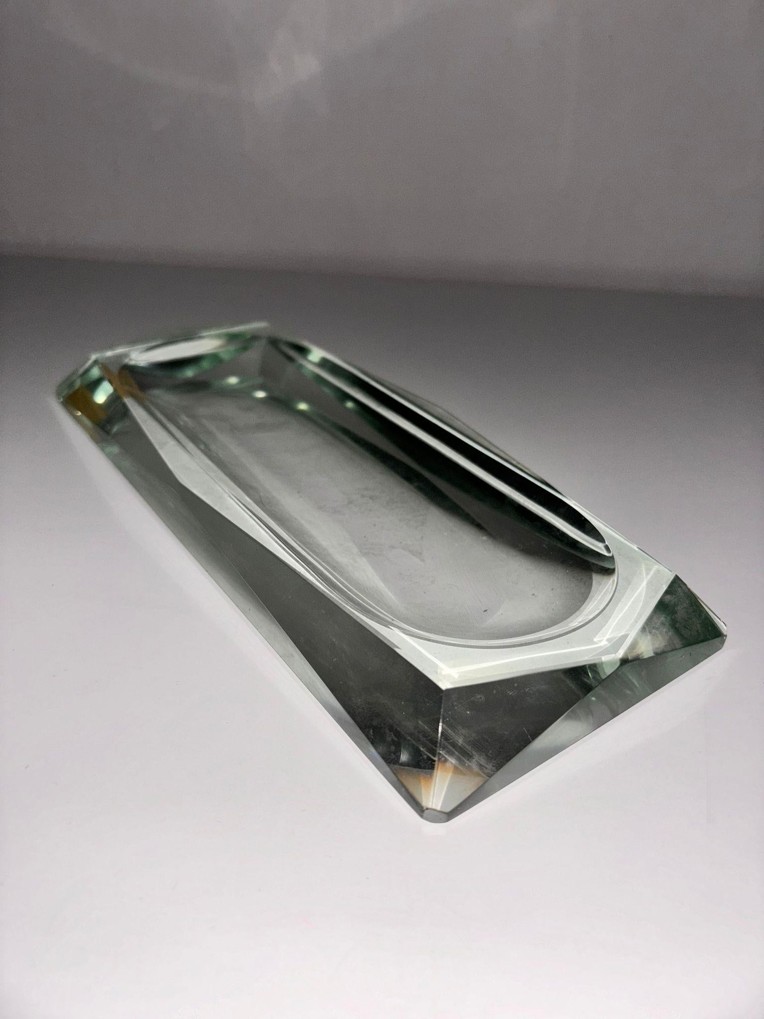 Ashtray
by Fontana arte
Italy, 1950's.
Be won over by the elegance of this exquisite ashtray or Vide-Poche, made in Italy during the heyday of the prestigious Fontana Arte in the 1950s. The handcrafted faceted diamond rectangular shape design boasts
