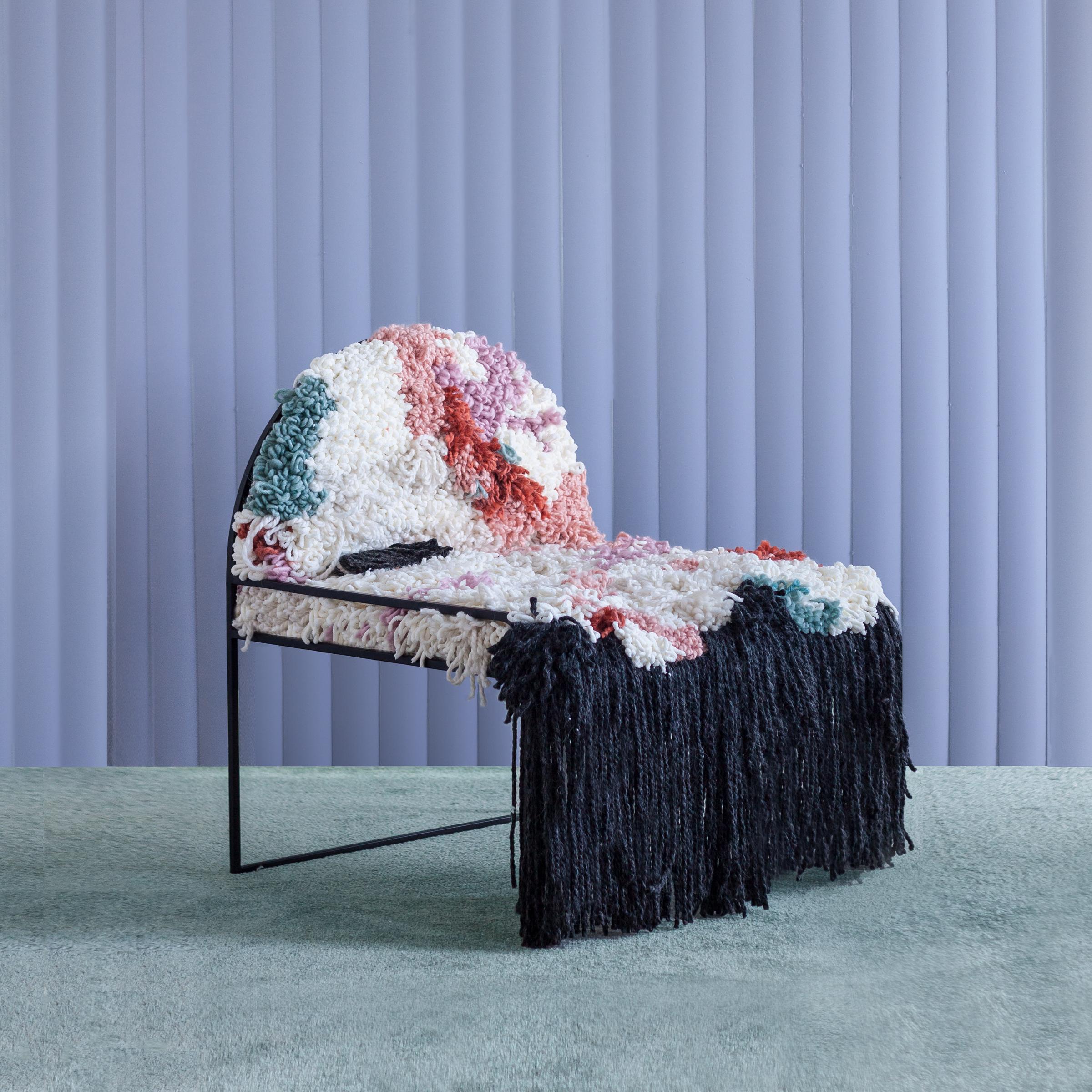 SW Fluffy chair by Soft-geometry
Materials: Handwoven yarn, stainless steel
Dimensions: 26 x 26 x 30” H

Chair dressed in a handwoven fluffy yarn seat on a simple arched frame in stainless steel. Each woven seat composition is abstract and