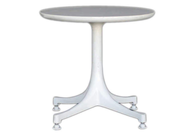 The pedestal table designed by George Nelson for Herman Miller was offered in a range of sizes and heights to serve as either a coffee table or end/side table. The bases were available in either polished or painted aluminum and the tops in black or