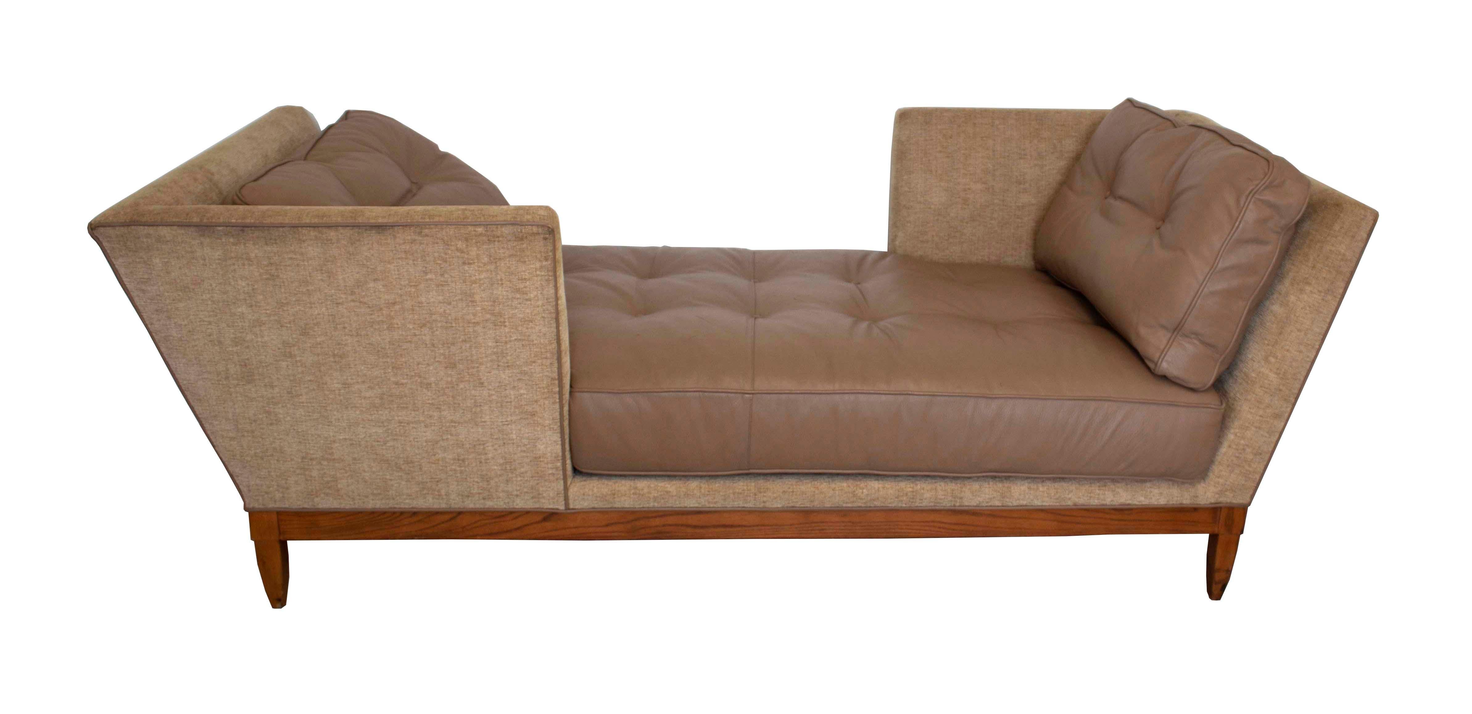 This comfortable settee, or tete a tete seats two generously, creating a nook for reading or conversation space. The plush upholstery supports leather monochromatic seat and back cushions, detailed in welt and tufted buttons. The wood frame and