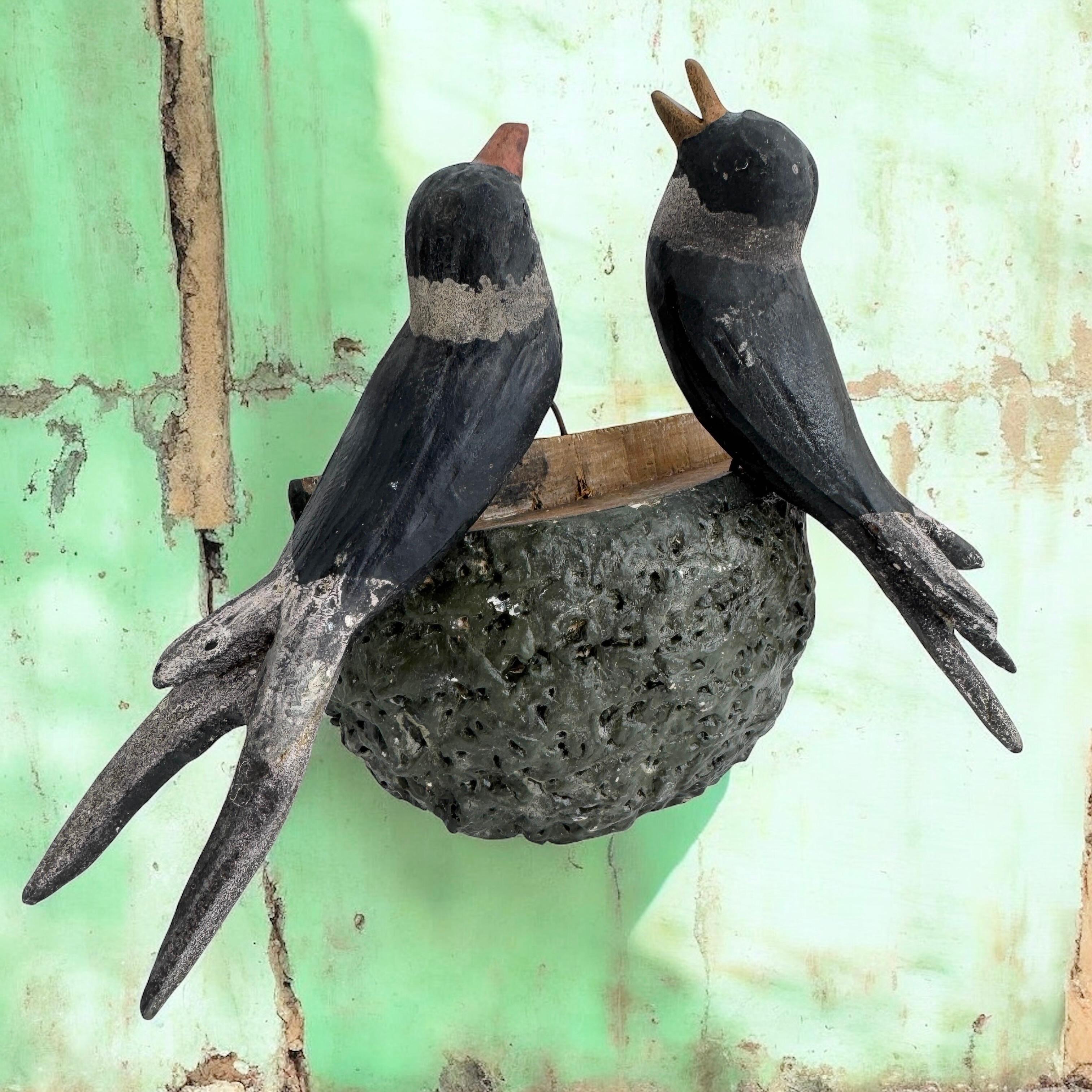 A beautiful large size Austrian 19th century, carved wood, polychrome painted, wire feet, metal eyes, wooden base in nest shape naturalistically covered with dirt, slightly crumbled, parents with three young.
The tradition of these in Austria called