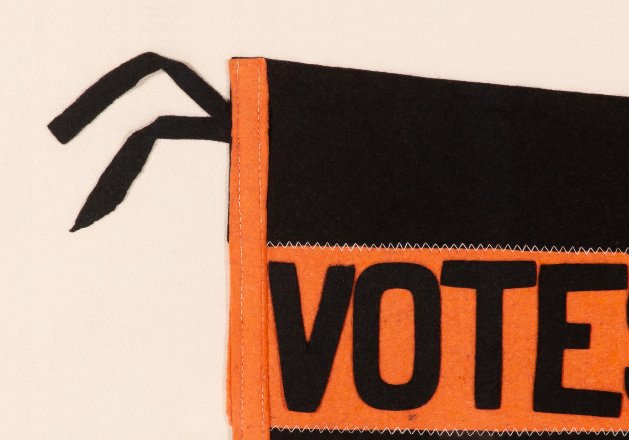Large, swallow tailed, suffragette pennant in a black & orange color combination unique to this example, with applied lettering that reads 