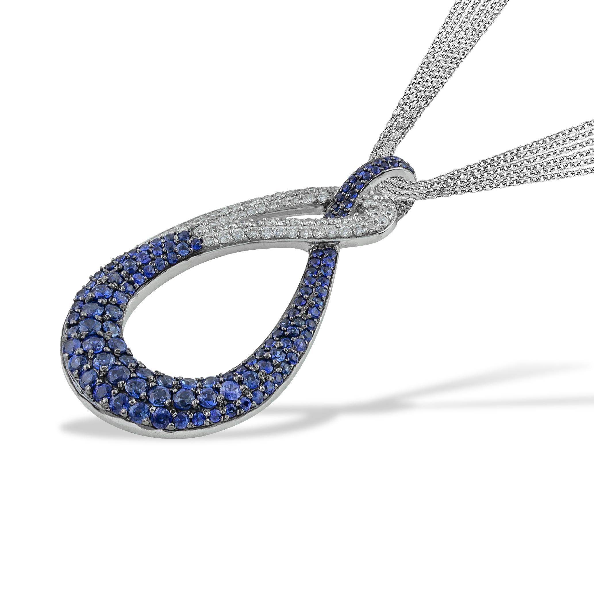 Swan Blue Pave Sapphires and Diamonds Pendant Necklace in 18kt White Gold. This blue sapphire organic shape necklace comes with Multi Chain ( x4 diamond cut rolo chain) . This necklace belongs to 