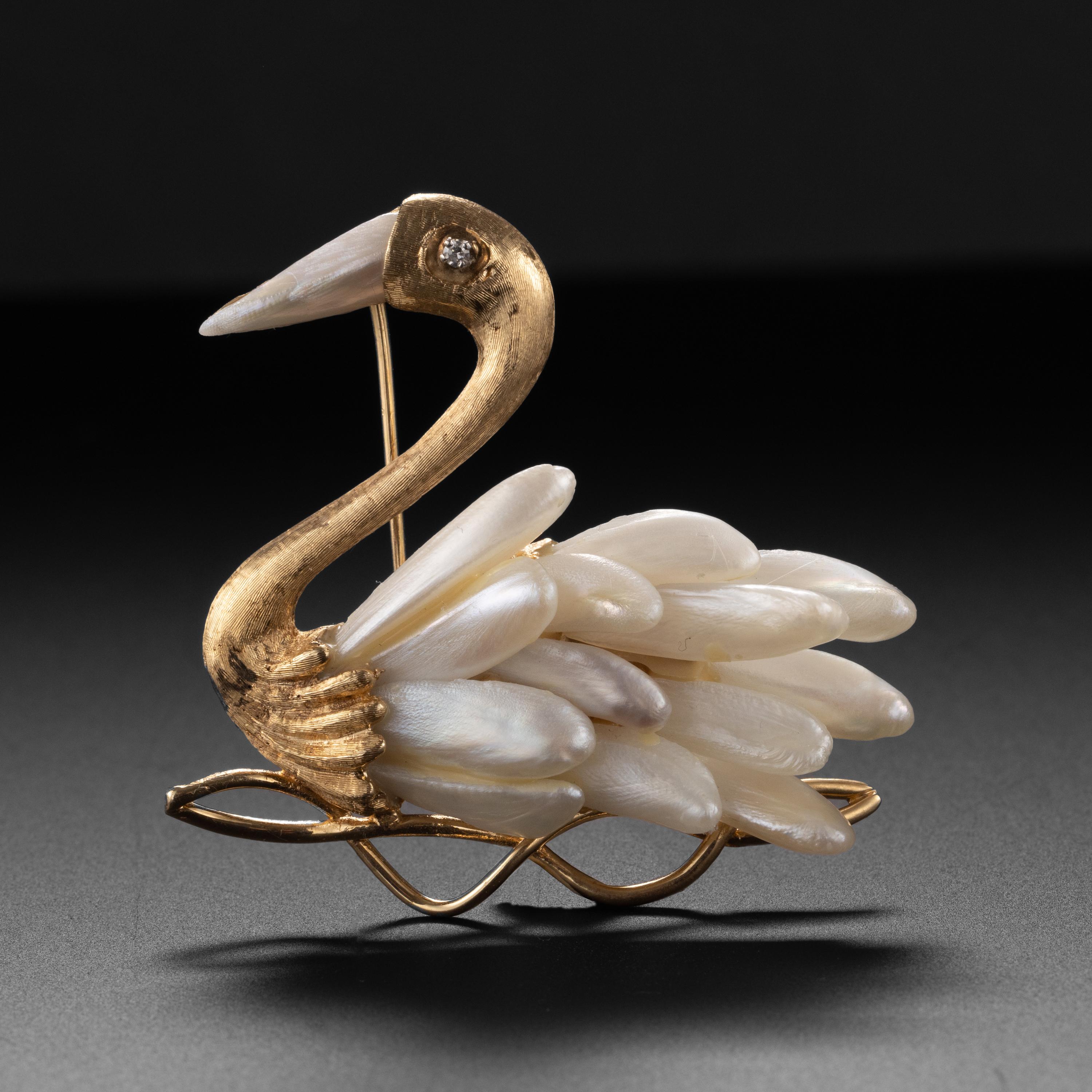 Whimsical and elegant, this highly detailed brooch was skilfully, artistically created entirely by hand in the middle of the previous century (circa 1940s-1950s). Crafted in 18K yellow gold that has been heavily worked, etched by hand to create the