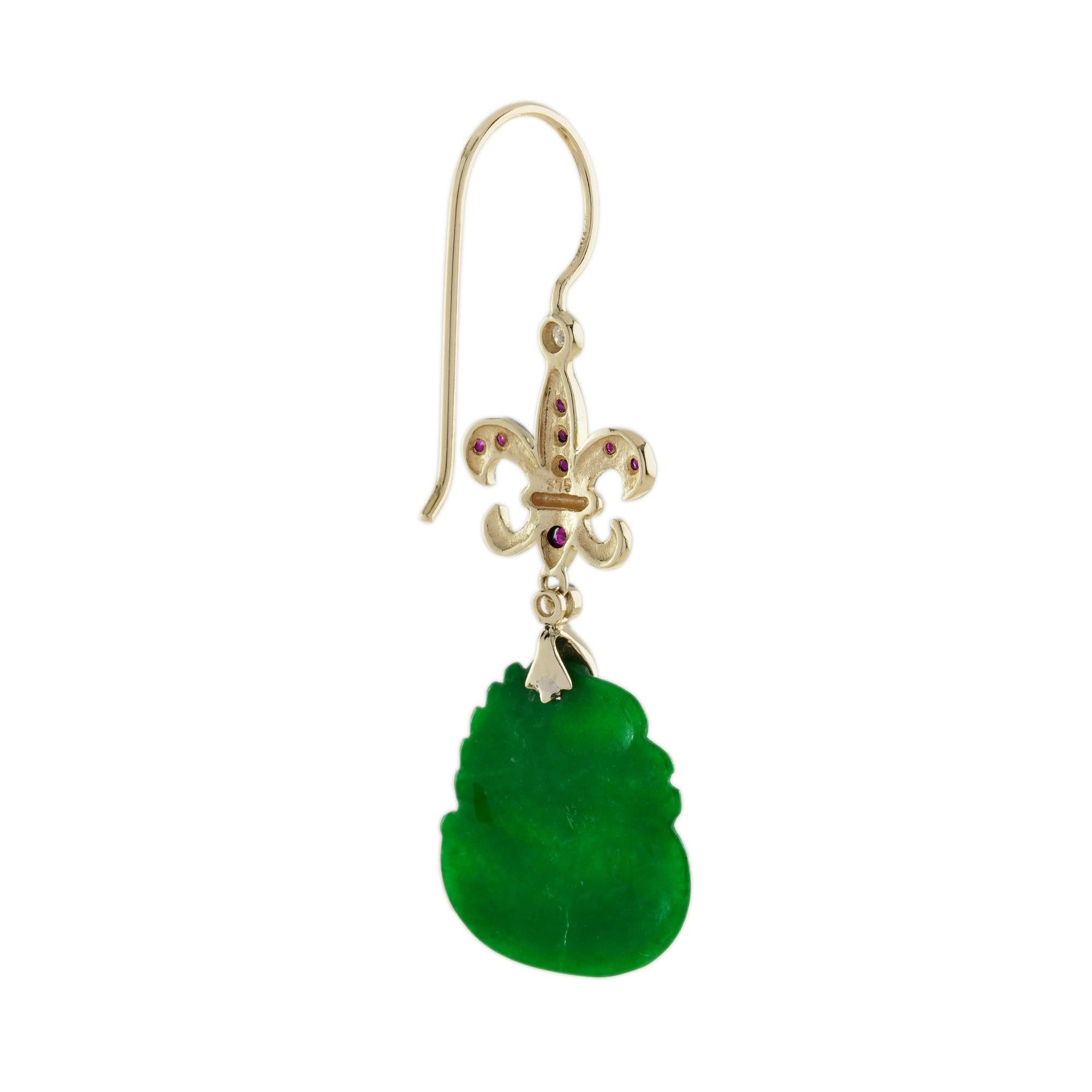The natural jade in these lovely earrings has some very special shape. Both pieces have a strong green color and well swan carvings. The jade is suspended in a 9k yellow gold setting with ruby lily flower symbol shape on the top. The earrings