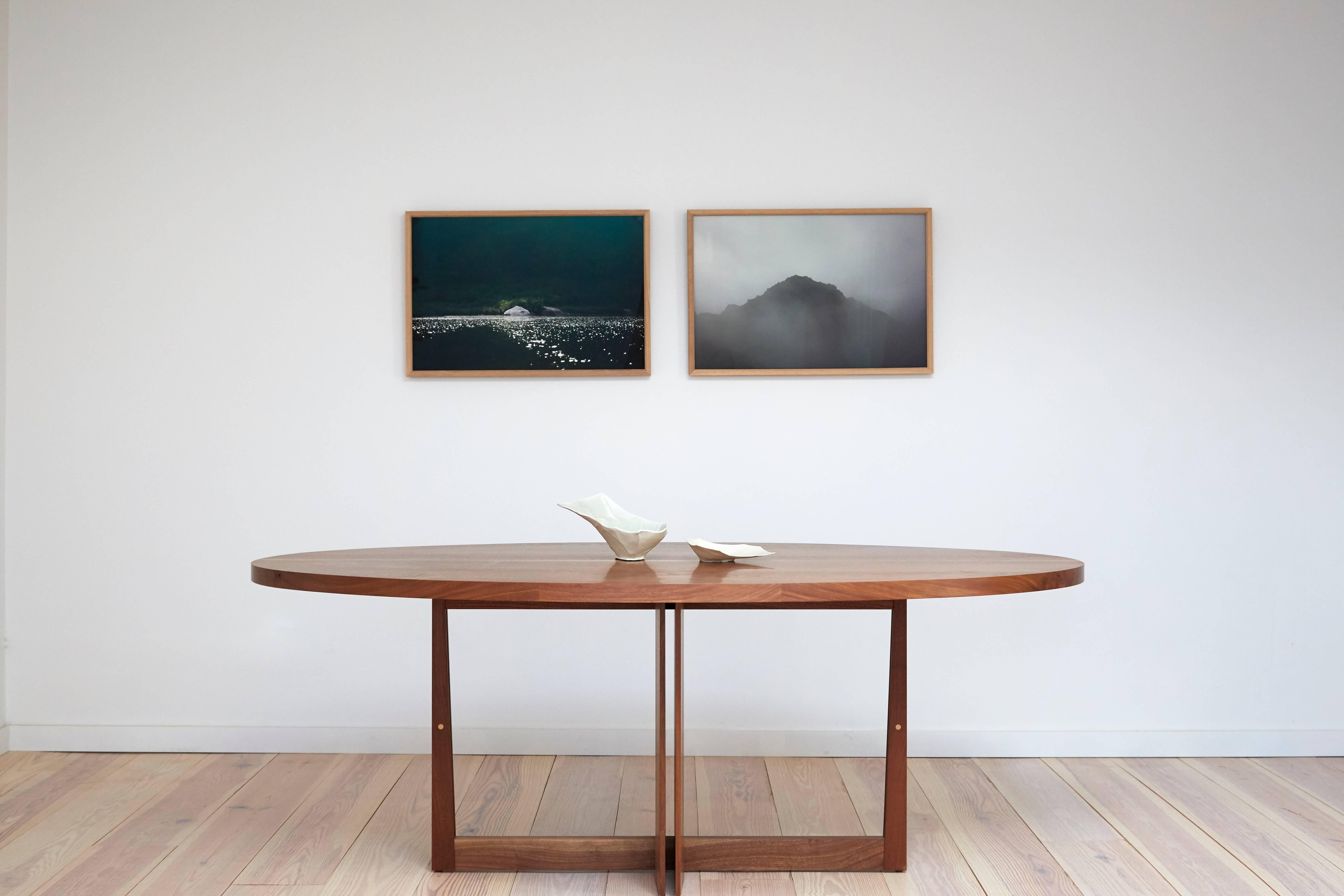 Though delicate in appearance, the base of the Swan Table is an intricate, rigid combination of structure and form. Its solid wood top is made from the highest quality of hand-selected black walnut, sourced on the American east coast. This piece is