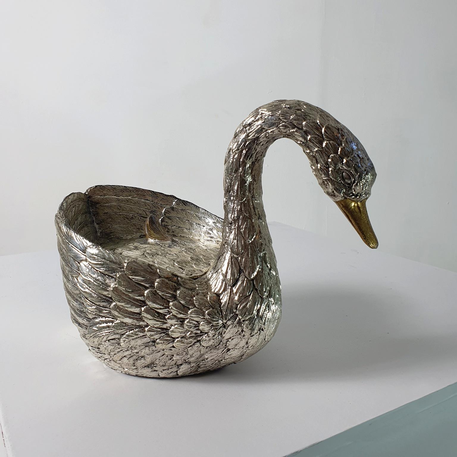 Iconic ice bucket shaped like a swan by italian designer Mauro Manetti, Florence Italy in silver guilt metal. Stamped M.M. at the bottom. It has the original liner which is in very good condition without cracks or chipping.