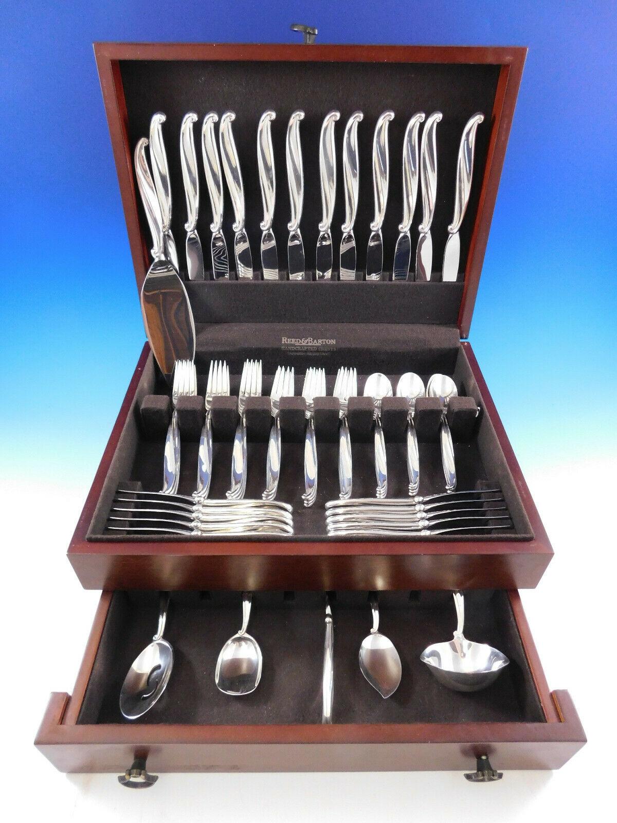 Modern design Swan Lake by International, circa 1960, sterling silver flatware set, 66 pieces. This set includes:

12 Knives, 9
