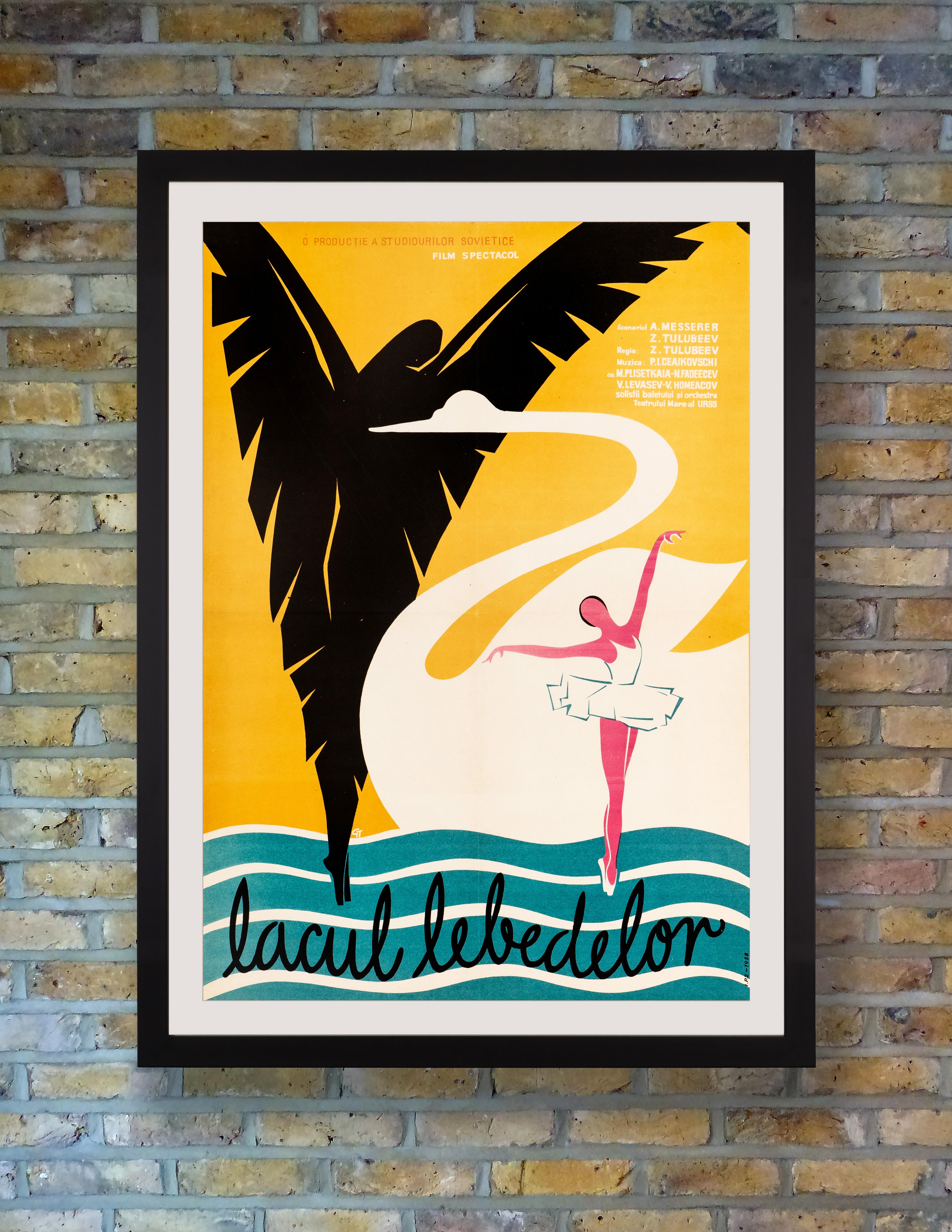 Evoking the beauty and grace of the Bolshoi ballerinas with a dramatic depiction of an elegant white swan beneath the malevolent shadow of a black swan, this enchanting poster was issued for the Romanian release of ‘Lebedinoe Ozero’ or ‘Swan Lake,’