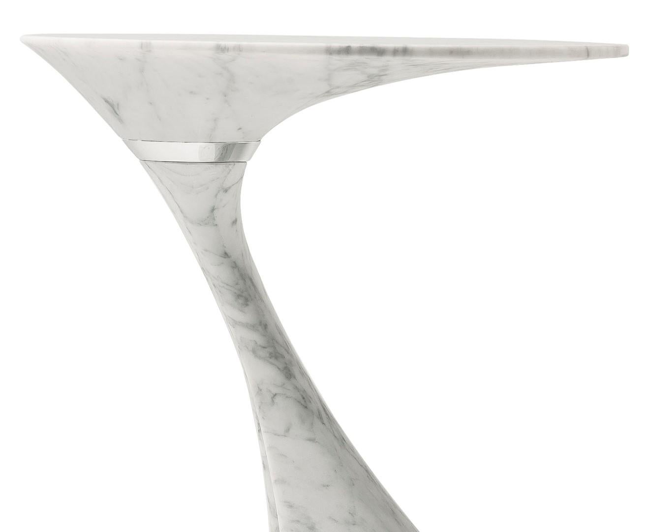 Part of the Swan series of striking side tables, this elegant piece is modern and sophisticated, boasting an asymmetrical silhouette and a cantilevered base that were created by a seven-angled robot cutter. This unique piece is made of Carrara