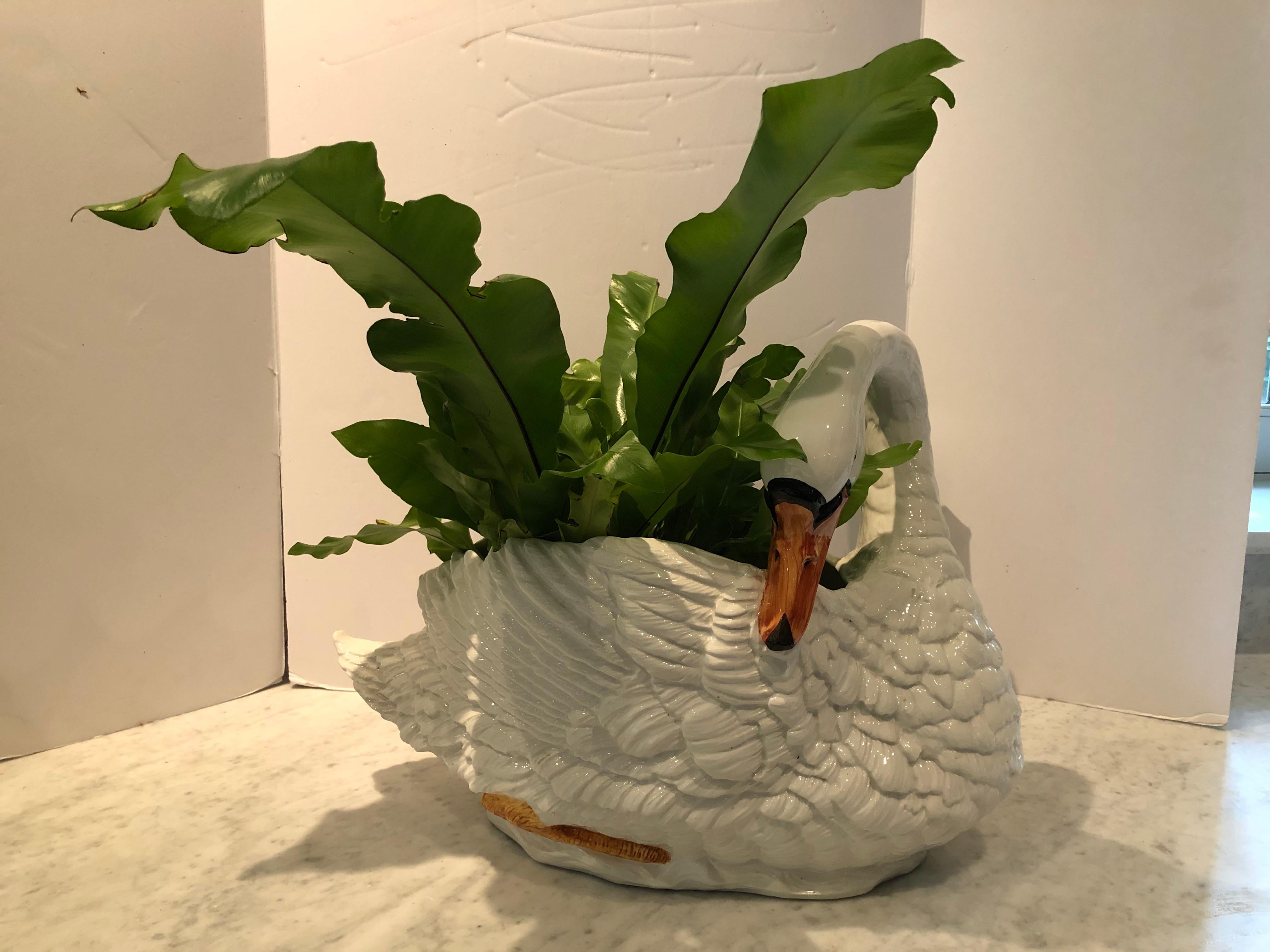 Elegant ceramic cachepot in a swan design by Chelsea House. The cachepot is large enough to make a statement as a centerpiece and has wonderful detail. Signed on the bottom. Measures 20” W x 10” D x 15” T. USA, 1990s, excellent condition. $1100.