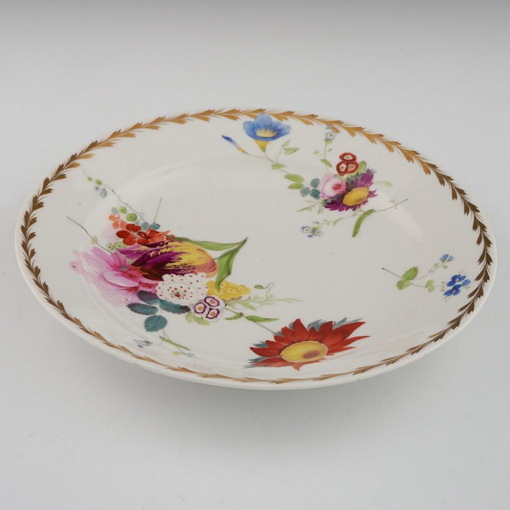 22121707 Swansea Porcelain Dessert Plate By Henry Morris, c1816

Additional information:
Date : 1815-1817
Period : George III
Marks : none
Origin : Swansea, South Wales
Colour : polychrome and gilt on white grounds
Pattern : large central spray with