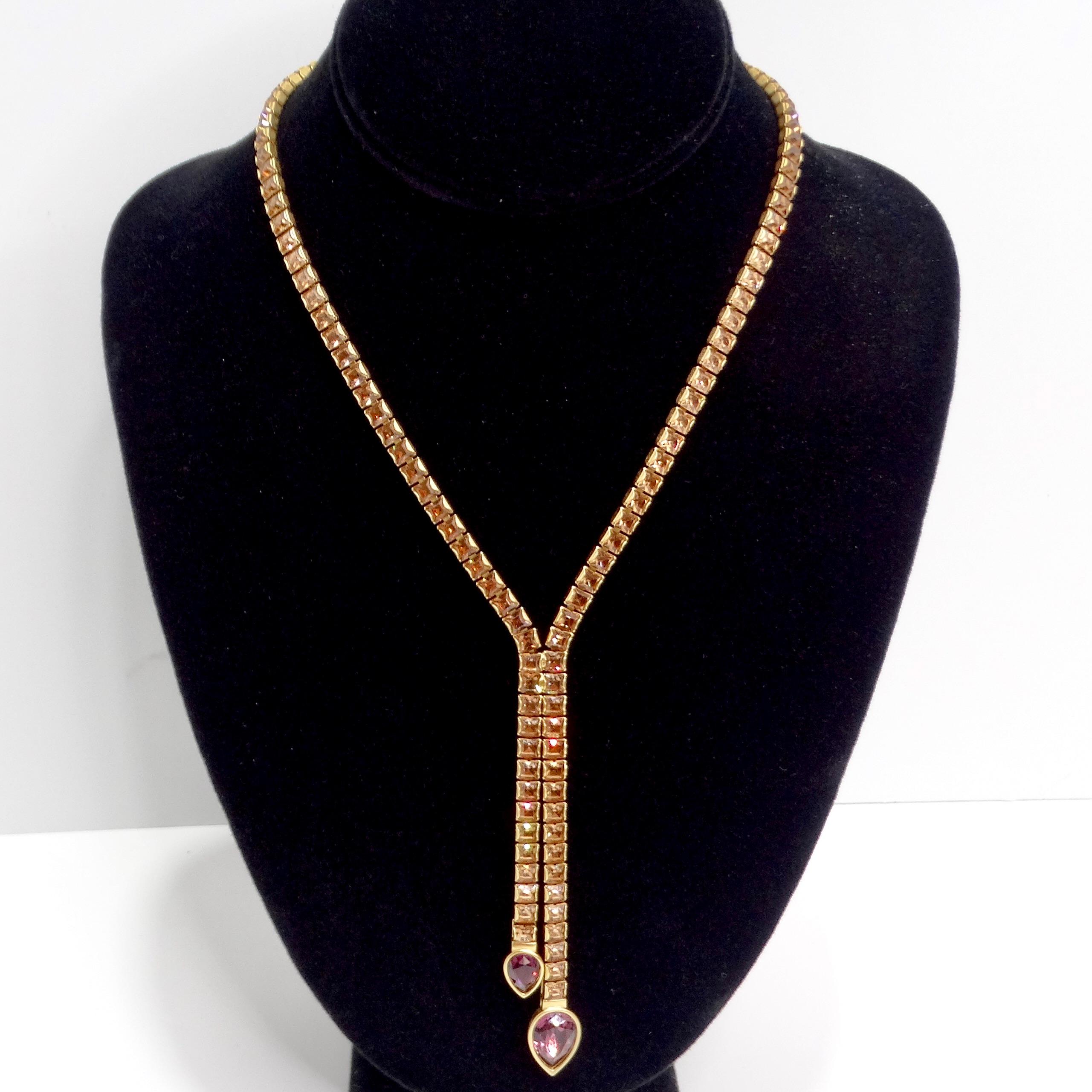Elevate your style with the Swarovski 1990s Purple Rhinestone Lariat Choker, a stunning piece that exudes elegance and sophistication. This exquisite lariat-style necklace is a timeless design from the 1990s, crafted with gold tone Swarovski